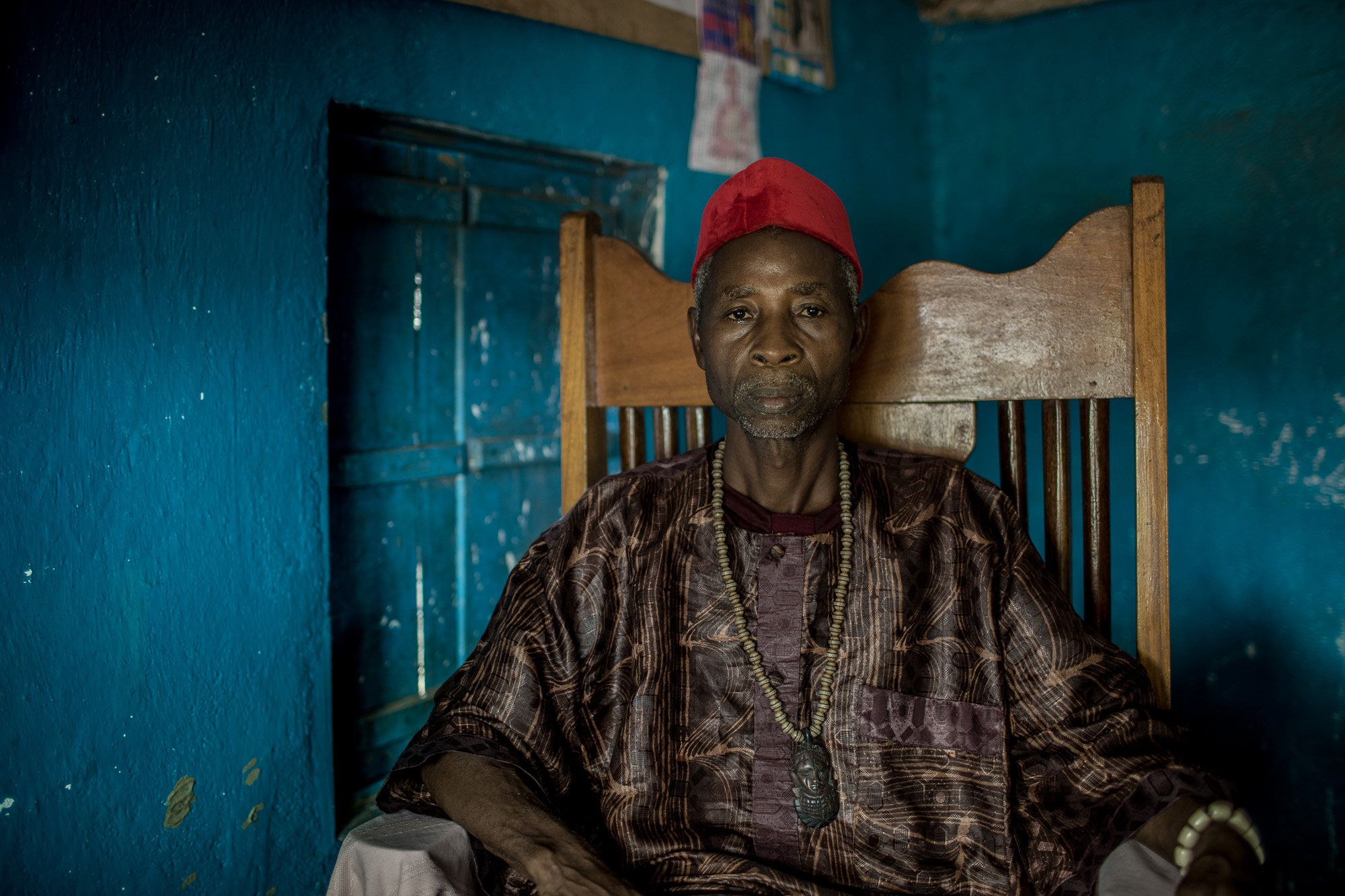  Cheo Johnson, chief of the Jogbahn Clan, poses for a photo.&nbsp;The Jogbahn Clan fought against the British-owned company Equatorial Palm Oil (EPO) when they tried to take over their land in 2013. The people in the community depend on the land for 