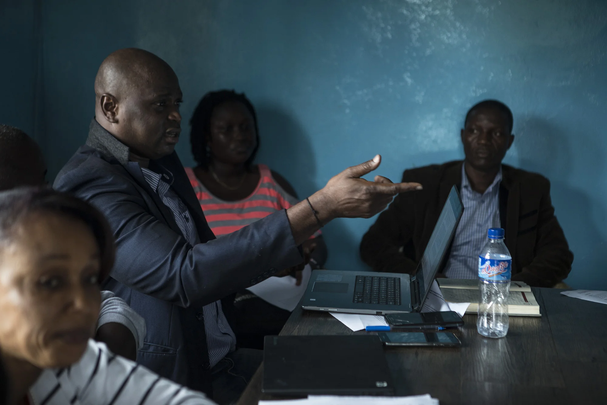 The Civil Society Organization (CSO) Working Group on Land Rights in Liberia come together to discuss the language of the current draft of the Land Rights Act. The CSO working group has been working towards getting the bill passed since it was introduced in 2013. The Land Rights Act will make it so that there is a separation between private land, government land and community land. Photo by Sarah Grile.