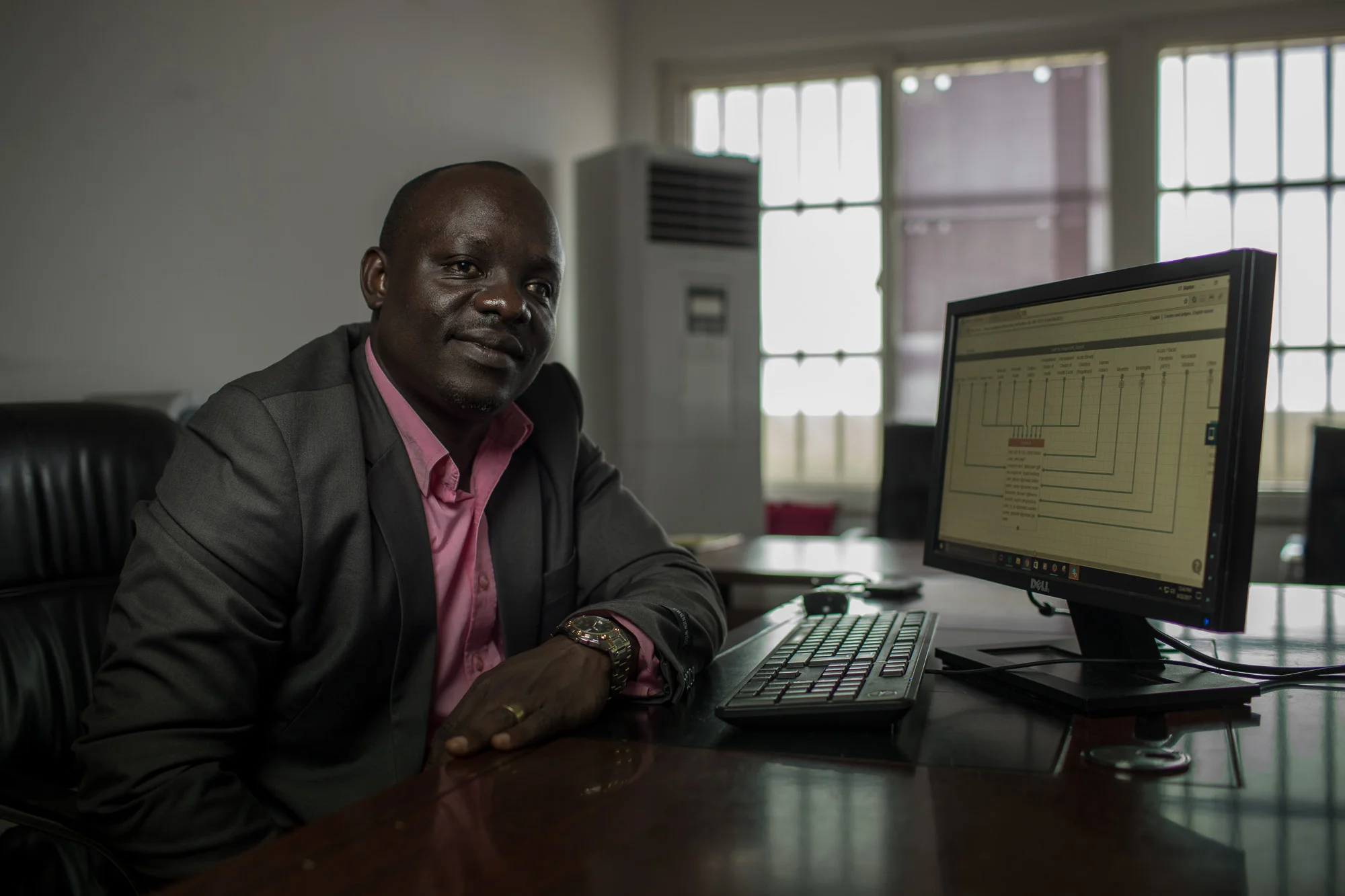 MONROVIA, LIBERIA: August 23, 2017 - During the Ebola outbreak that started in 2014 there was no centralized system for the Ministry of Health to communicate to all healthcare workers across the country at the same time. UNICEF and USAID teamed up to create a platform that utilized mobile phones to facilitate a two way communication system between healthcare workers and the centralized ministry. Now healthcare workers receive text messages on their phones with vital information when there is a health emergency. They can also use their phones to send important information like the status of supply stocks in the clinic. Photo by Morgana Wingard
