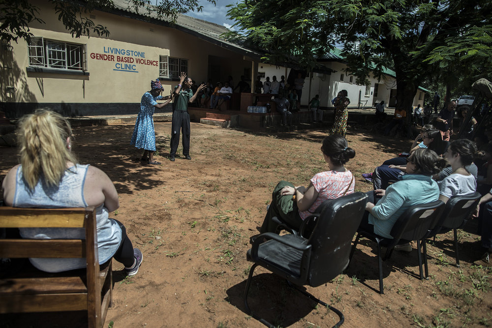  LIVINGSTONE, ZAMBIA: Feb. 20, 2018 - Members of the CARE Learning Tour to Zambia watch a community drama simulation about battery, abuse towards women and men and early marriage while visiting the One-Stop GBV Center in Livingstone. The delegation a