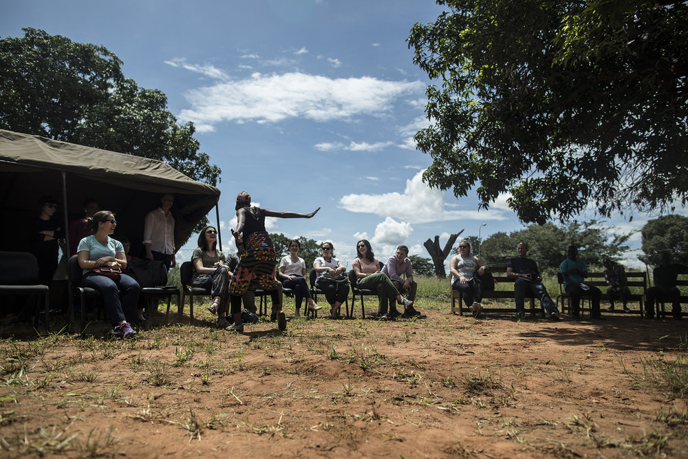  LIVINGSTONE, ZAMBIA: Feb. 20, 2018 - Members of the CARE Learning Tour to Zambia watch a dance presentation while visiting the One-Stop GBV Center in Livingstone.&nbsp;Photo by Sarah Grile. 