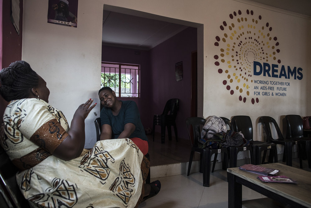  LUSAKA, ZAMBIA: Feb. 18, 2018 - Cecilia Mulenga, left, Program Staff at the DREAMS Center, and Prudence Moonga, right, Manager at the DREAMS Center, talk to each other while at the center in Lusaka.&nbsp;&nbsp;Photo by Sarah Grile. 