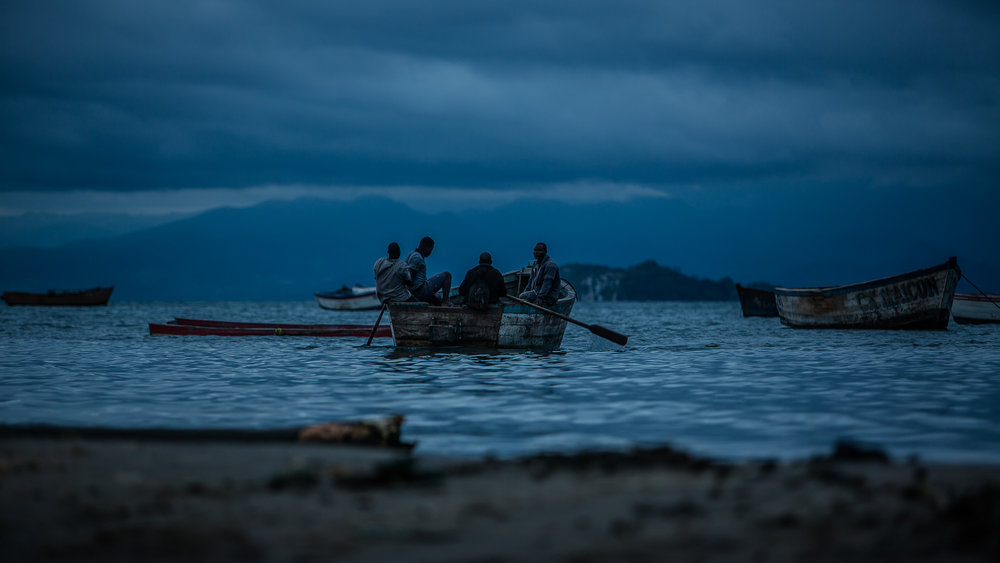 Fisherman approaching the shores of lake Malawi after the nights