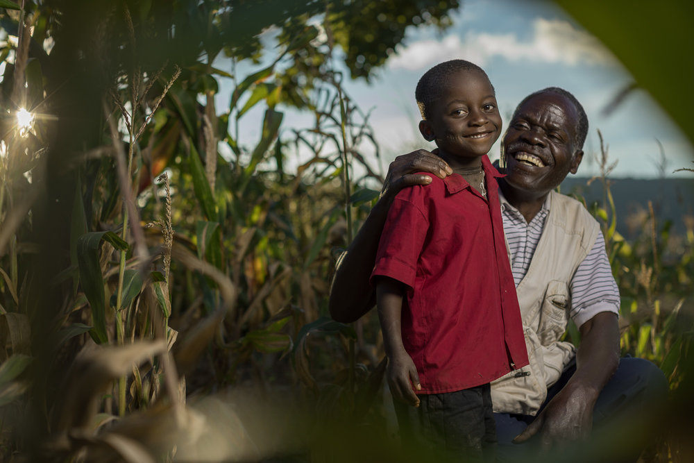 Malawian farmer Daniel Mhoni, 68, with his grandson