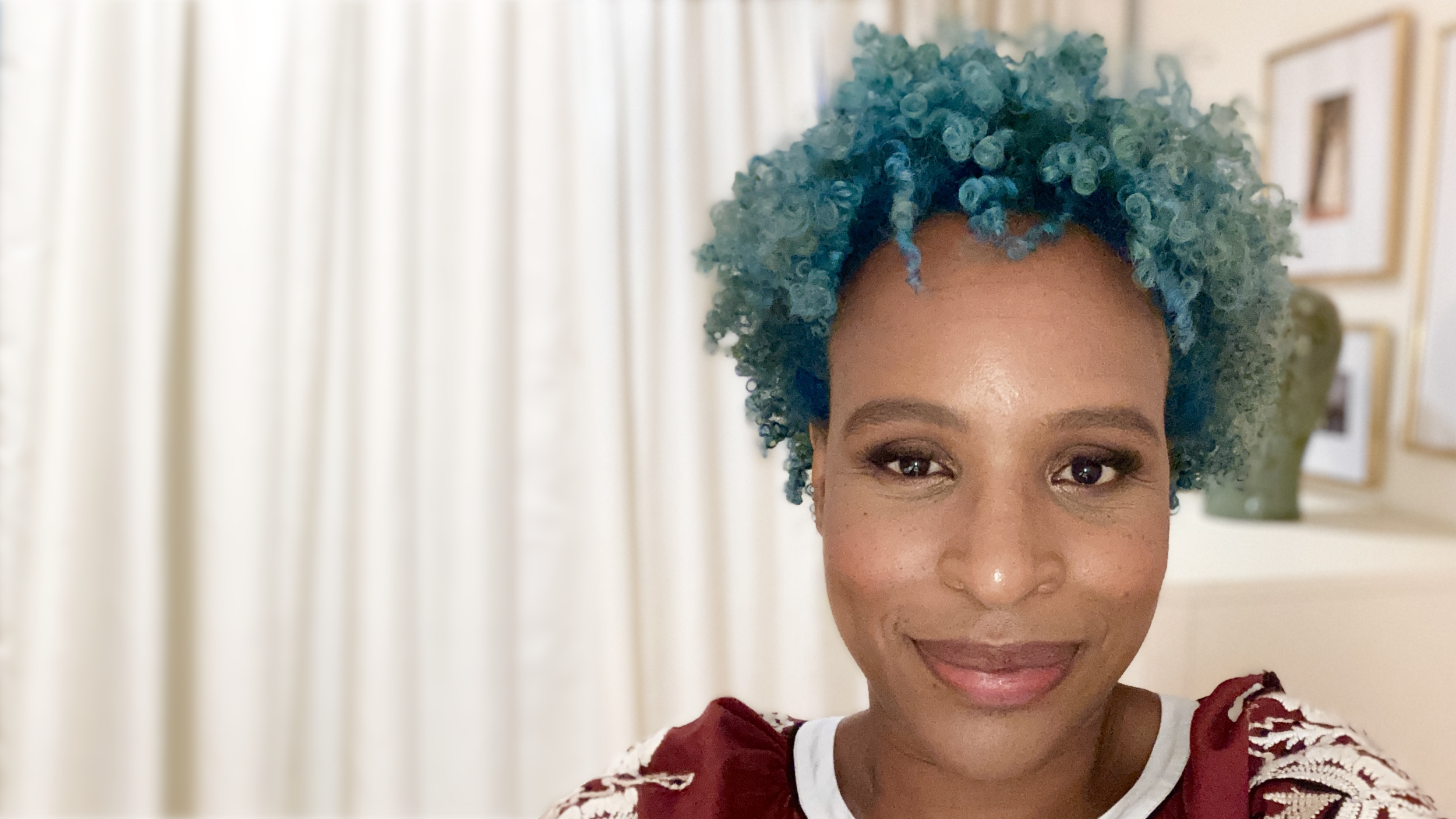 nicki blue hair author photo bedroom curtain.png