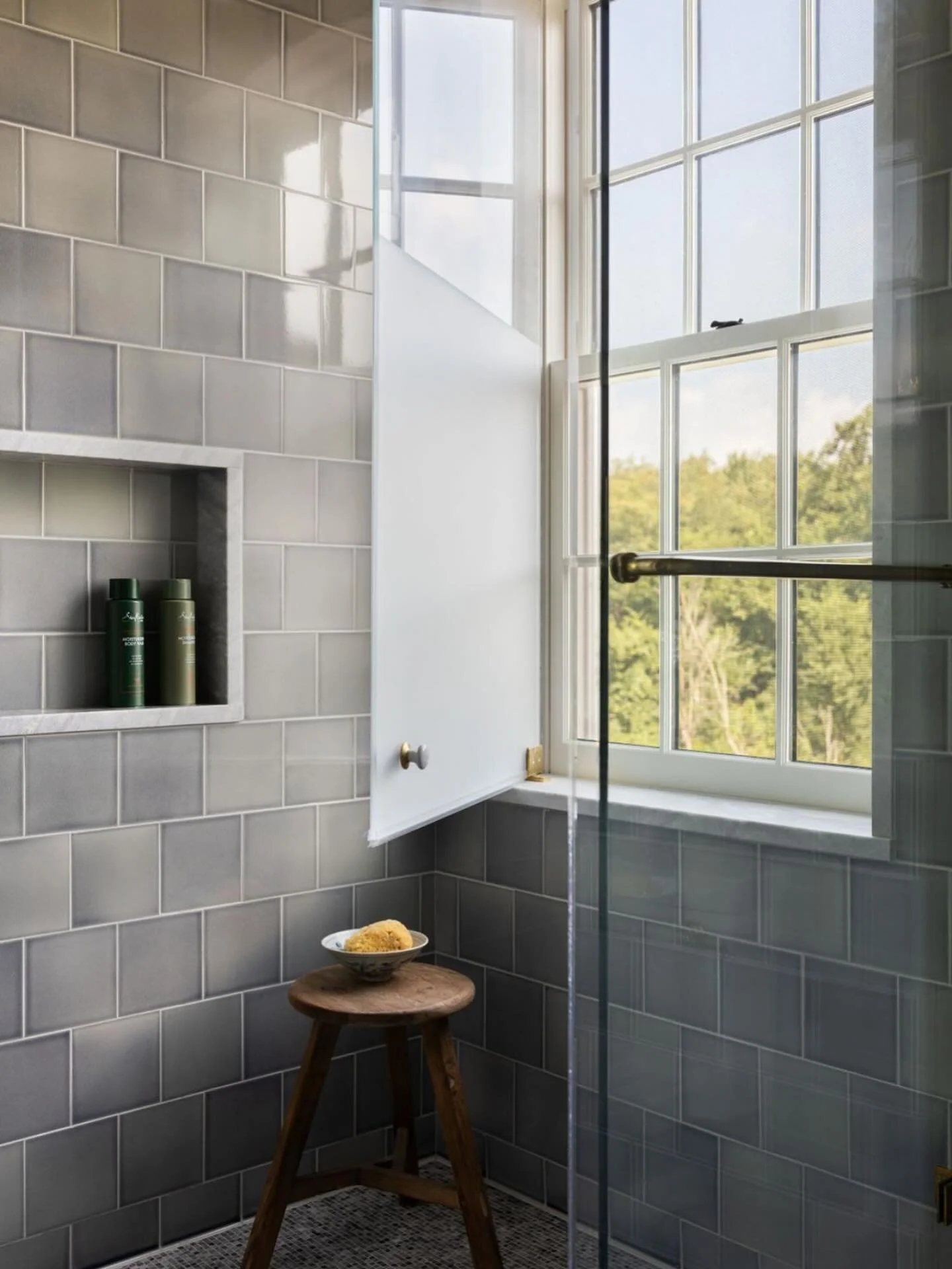 This grey/blue ceramic tile + a forest view (Not pictured-unlacquered brass exposed plumbing). Love this shower so much 🩶

Architecture: @designenmasse 
Build: @windsor_builders 
Photography: @aimeemazzengainteriors 
Styling: @cate.ragan.styling