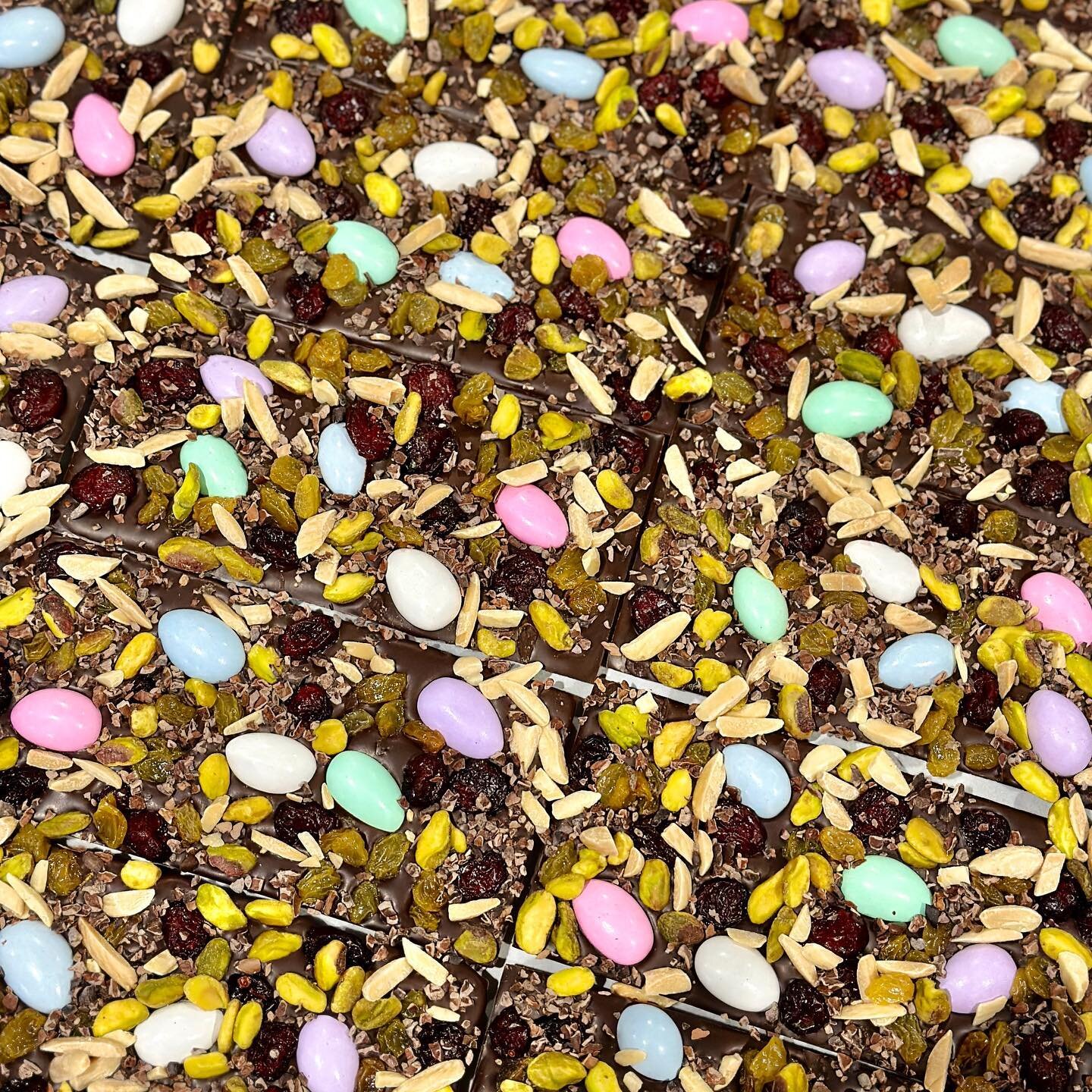 CONFETTI BAR: 63% dark chocolate solid bar then scattering, like confetti, dried cranberries, golden raisins, almonds, cocoa nibs, and pistachios to enhance the delicate fruity aroma and subtle acidity of this premium cacao.  In celebration of the Ea