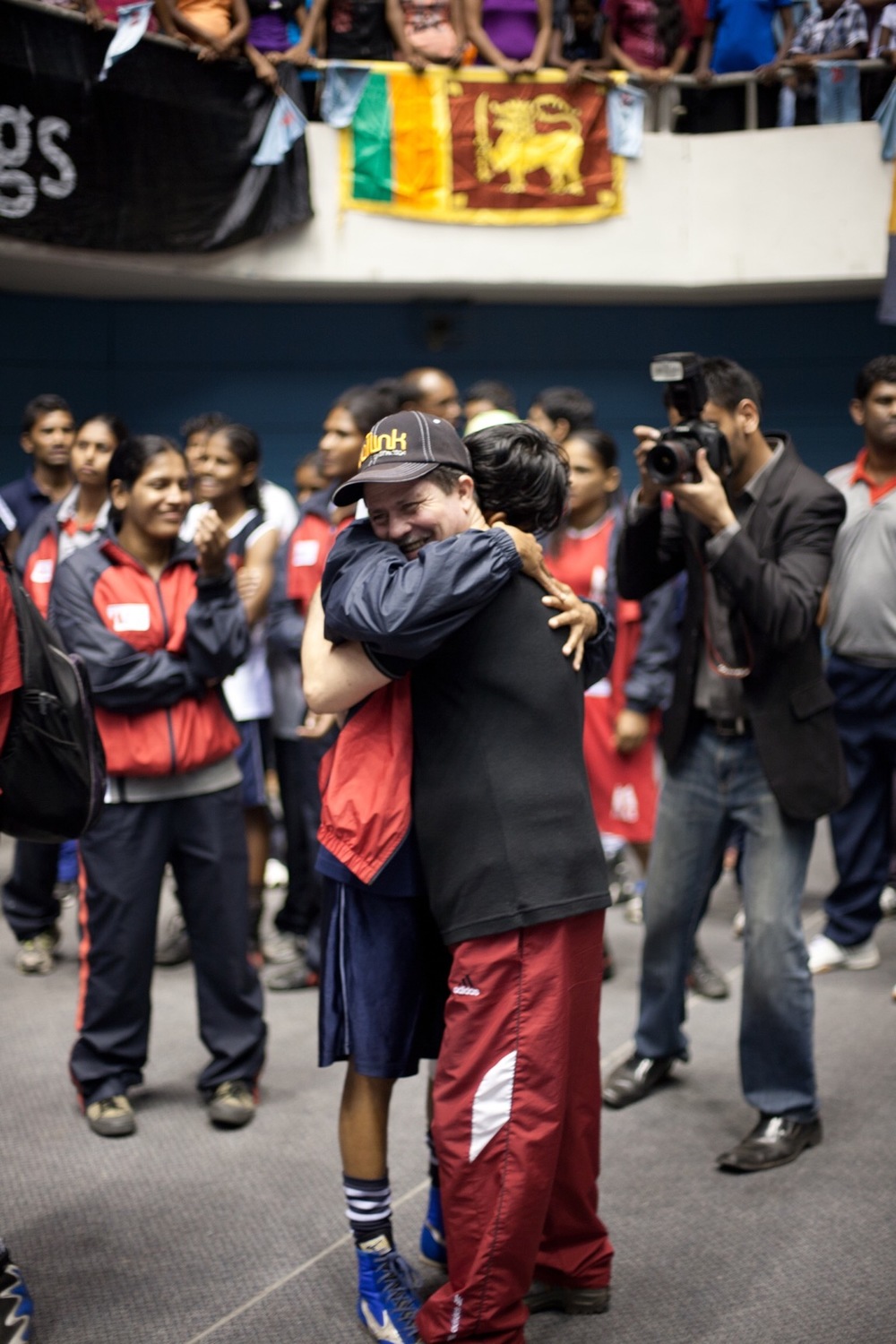 Anusha hugs Cuban coach Julio Concepcion Santana Padron (© Lee Bazalgette) 