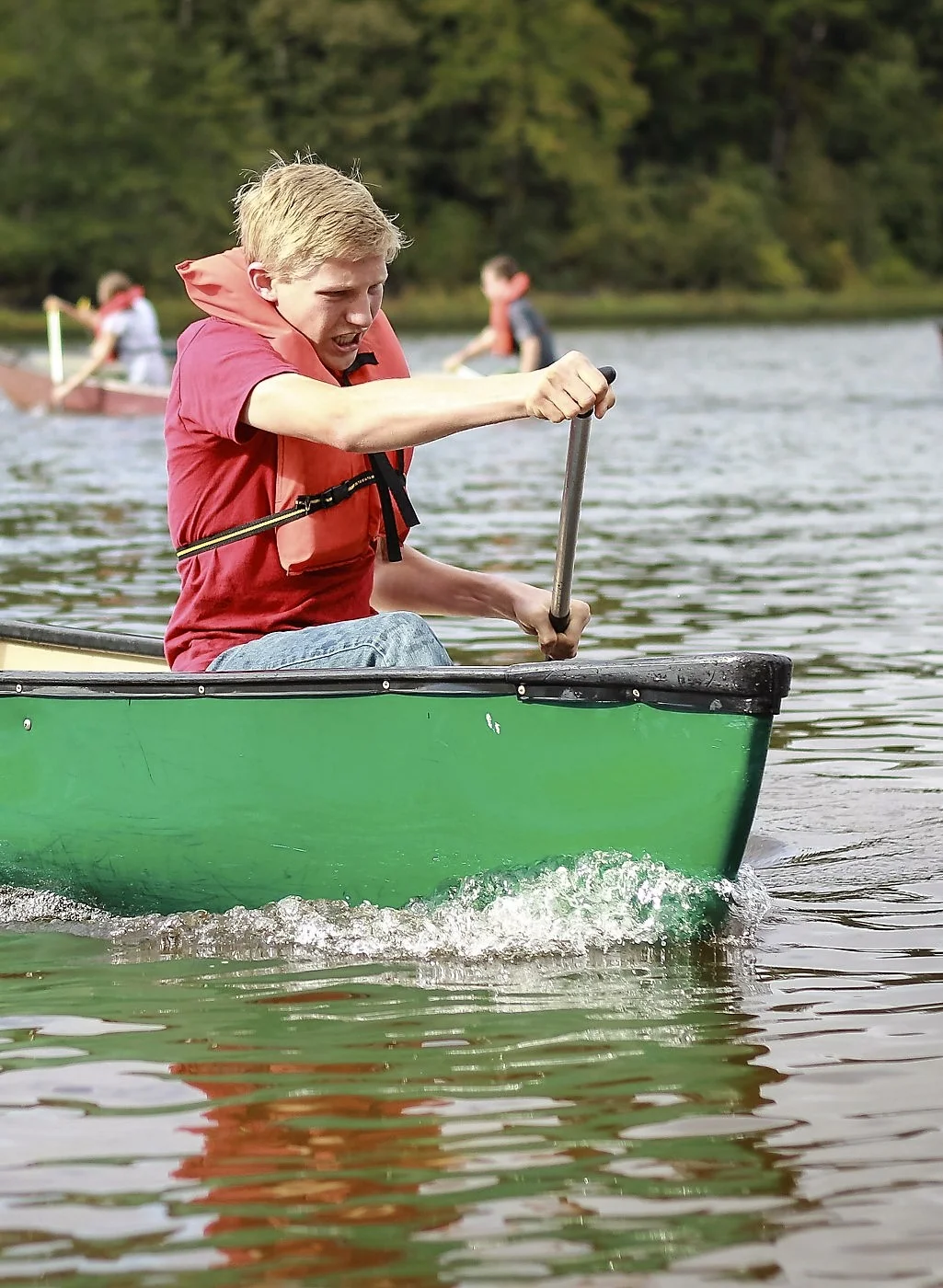 Silas in the bow of his and Laura's canoe - capturing second place for their canoe race!
