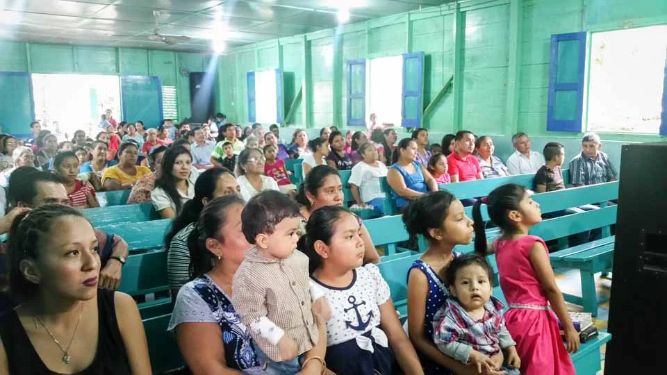 His church was surrounded by fields of coffee beans that are harvested by hand.
