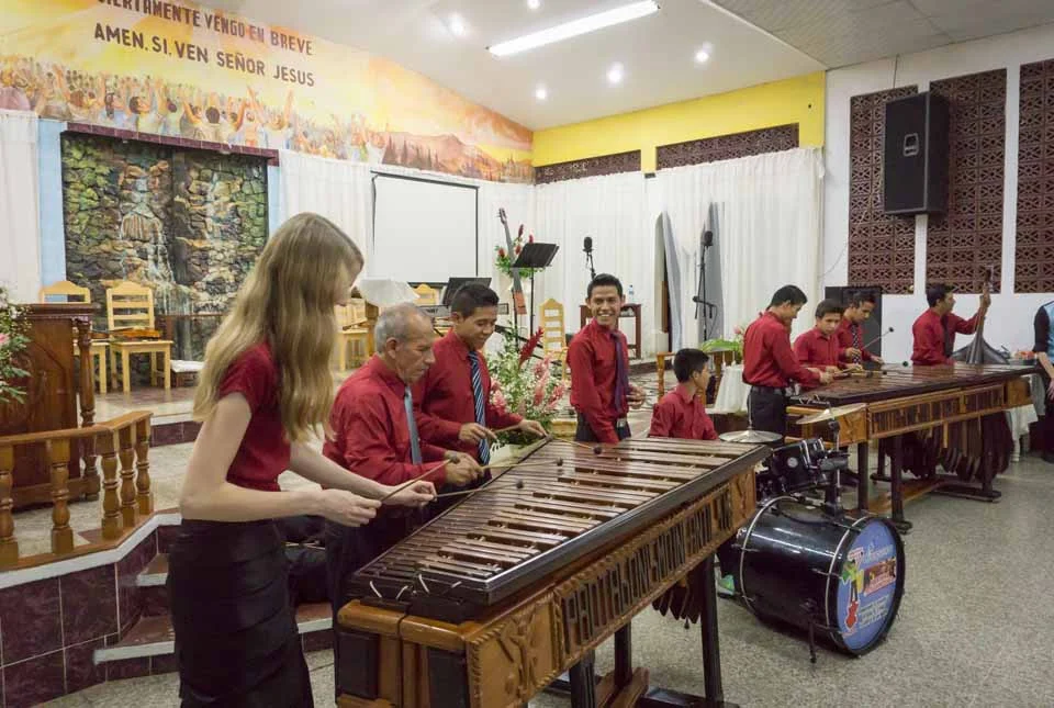 The Guatemalan churches were delighted to share their music with us in return! Here Laura was invited up to try her hand with the marimba ensemble!