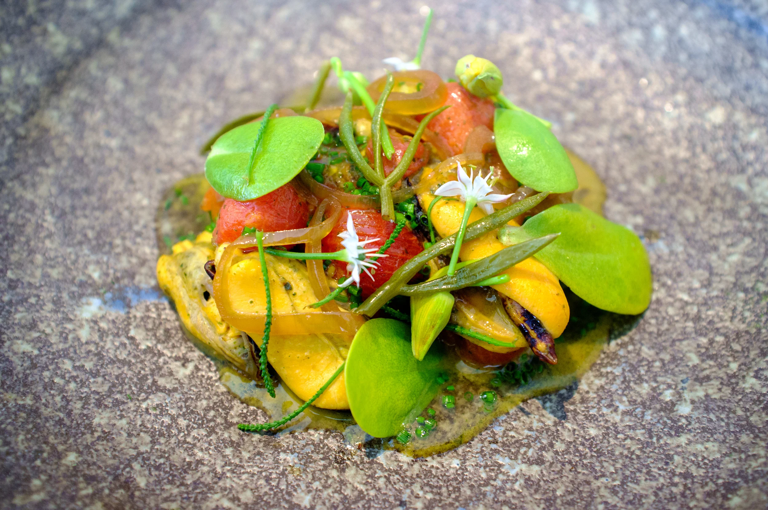 Tomatoes and mussels gently braised in sea butter