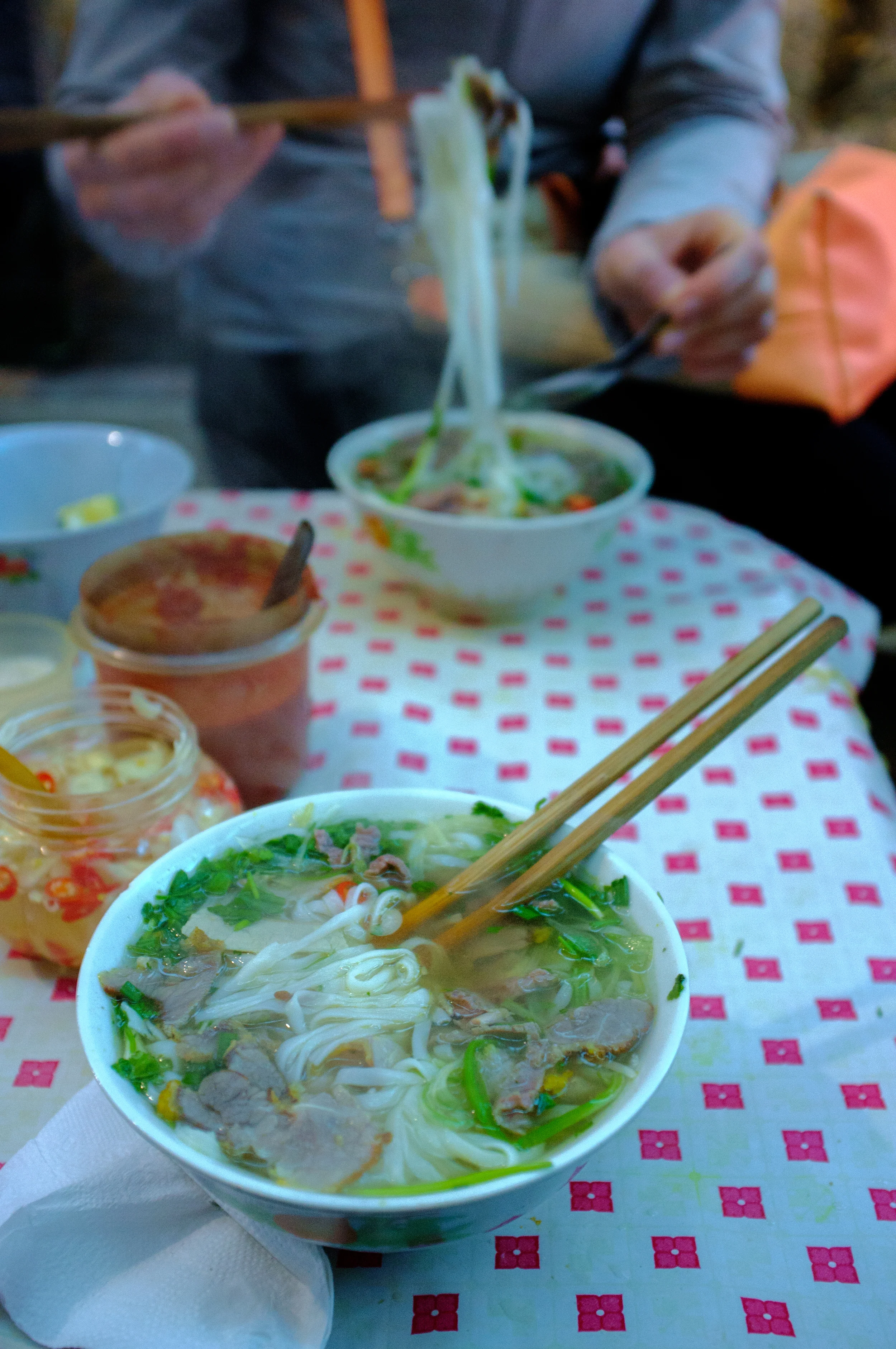 Hanoi: enjoying a bowl of phở