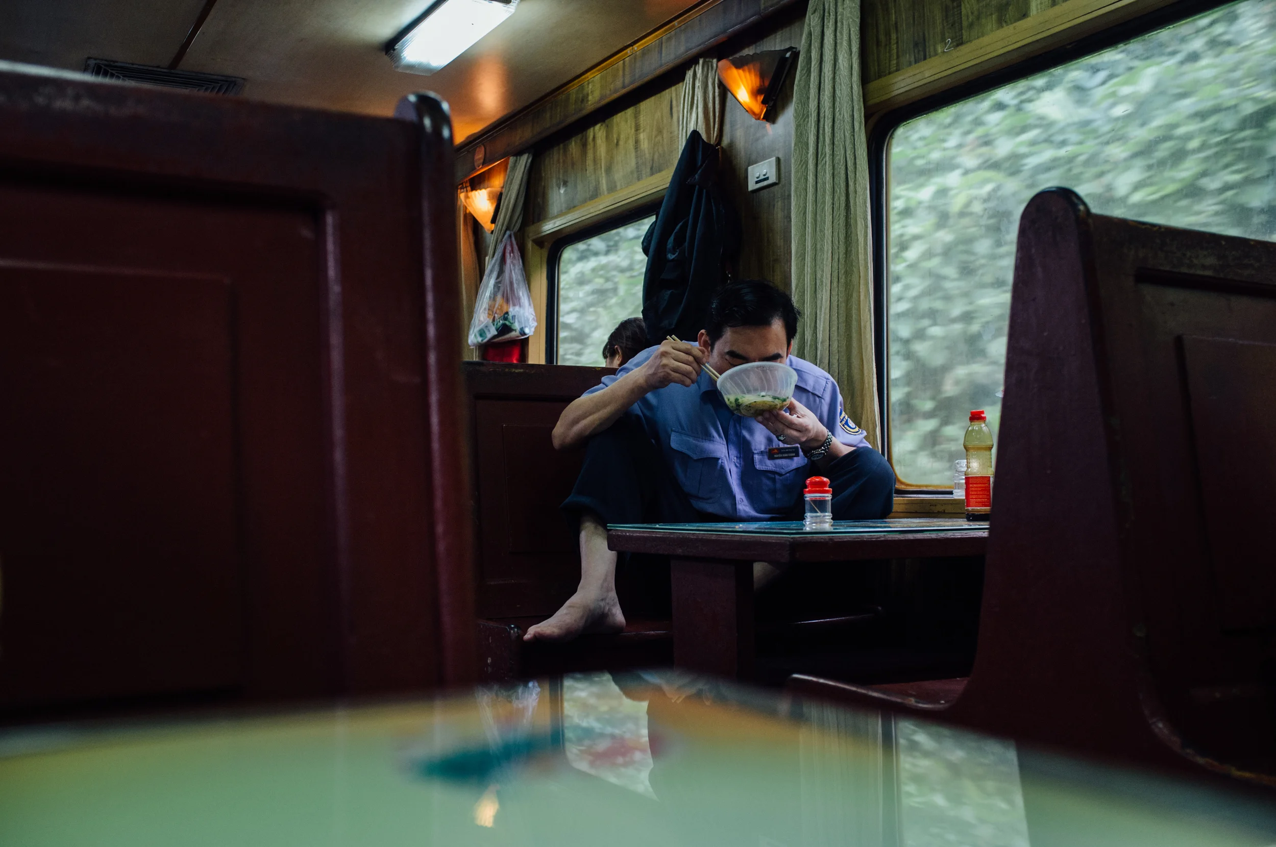 Vietnam Railway employee comfortably enjoying his own breakfast 