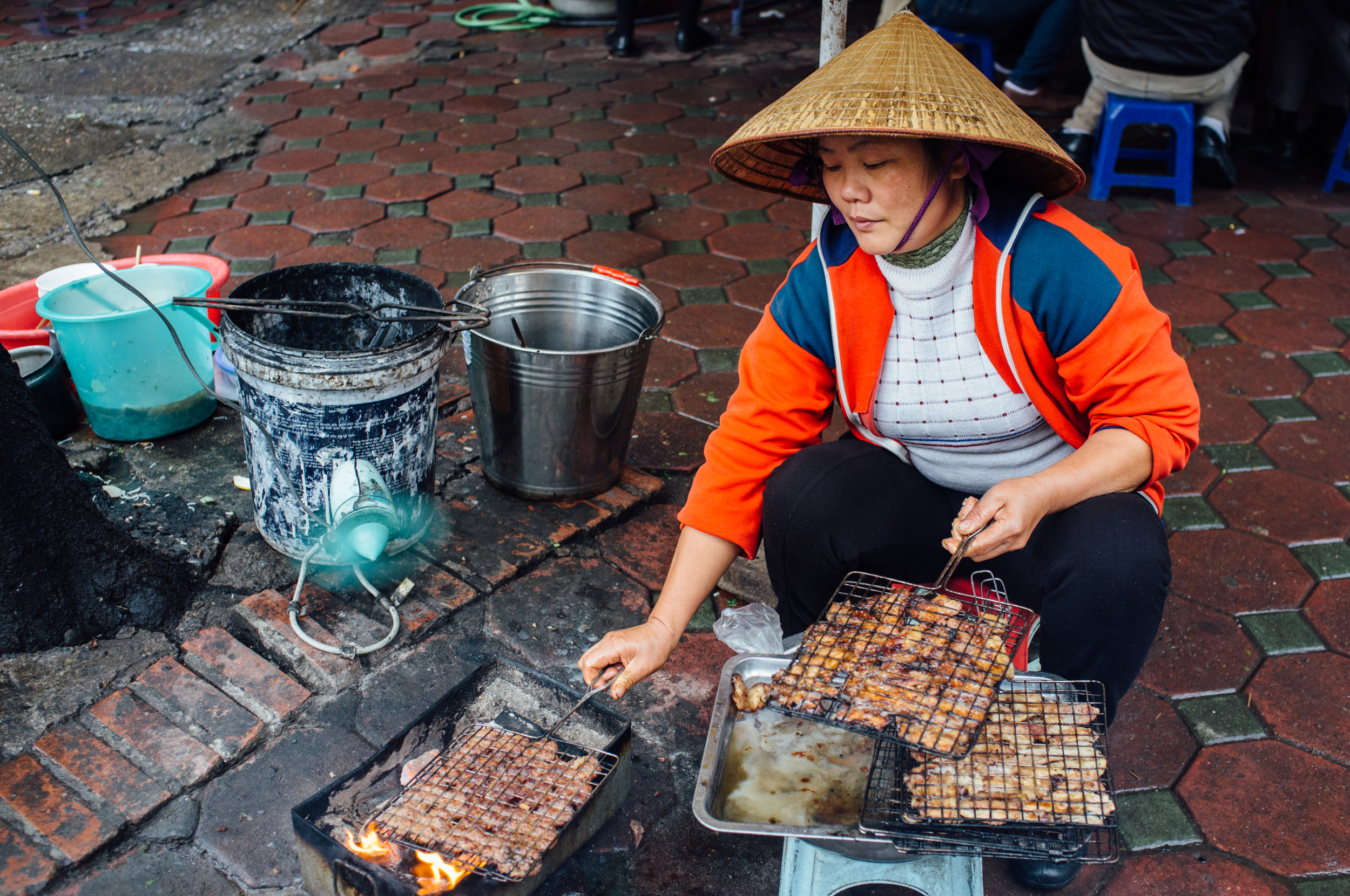 Bún chả prep on the streets of Hanoi. Notice the use of fan.