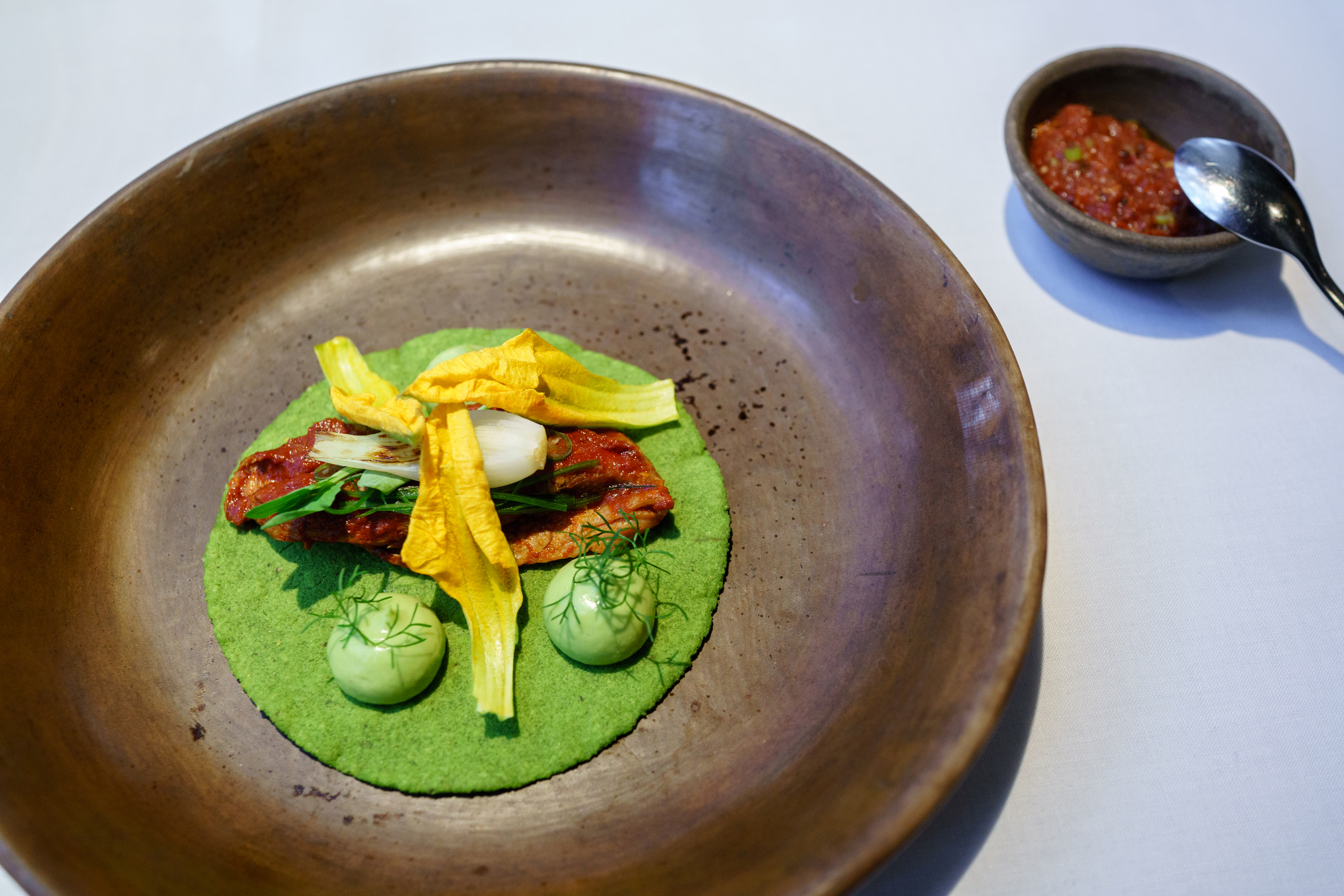 Suckling lamb taco, avocado leaf adobo, avocado purée, Pujol