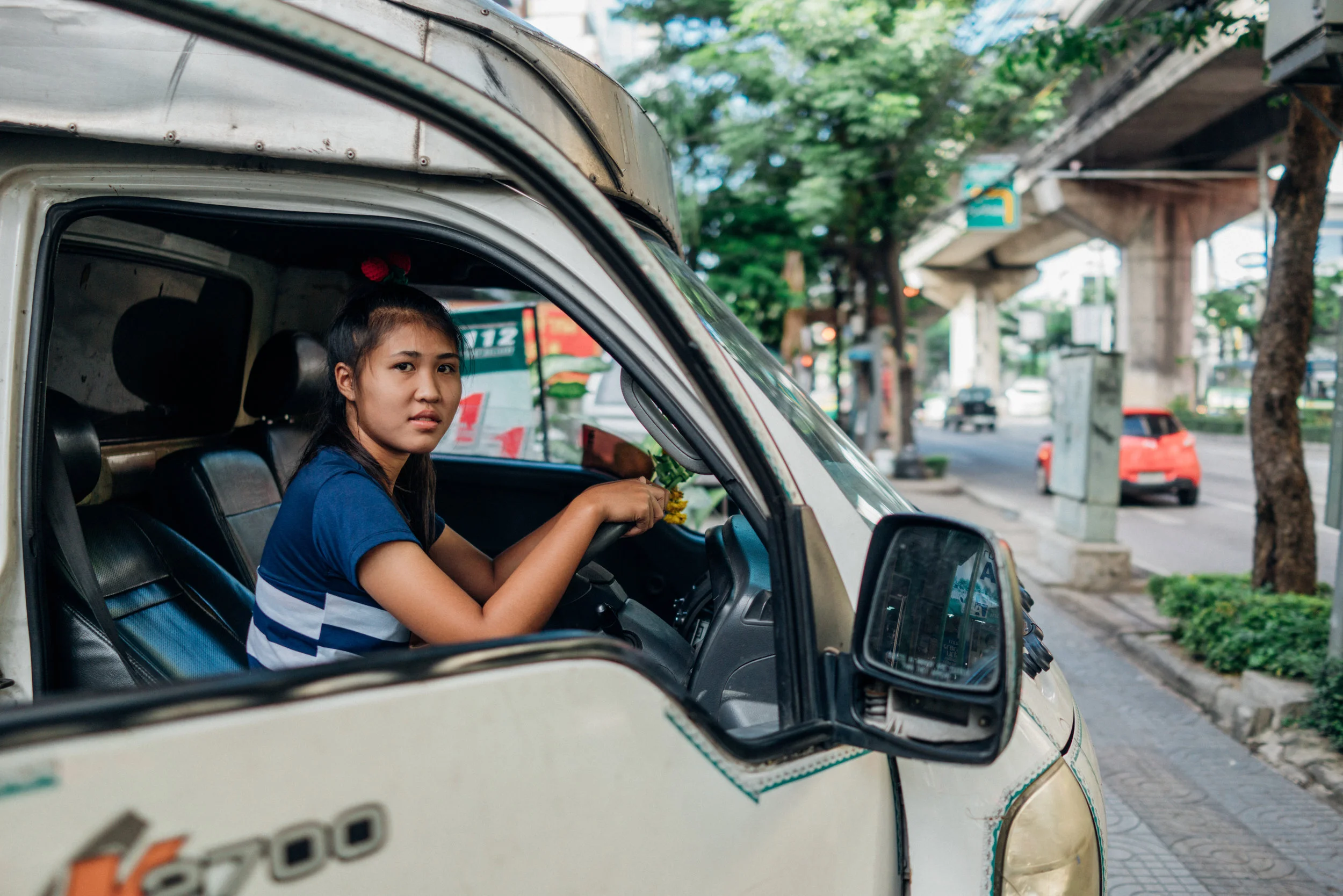 Tentative: a young girl resting in her truck