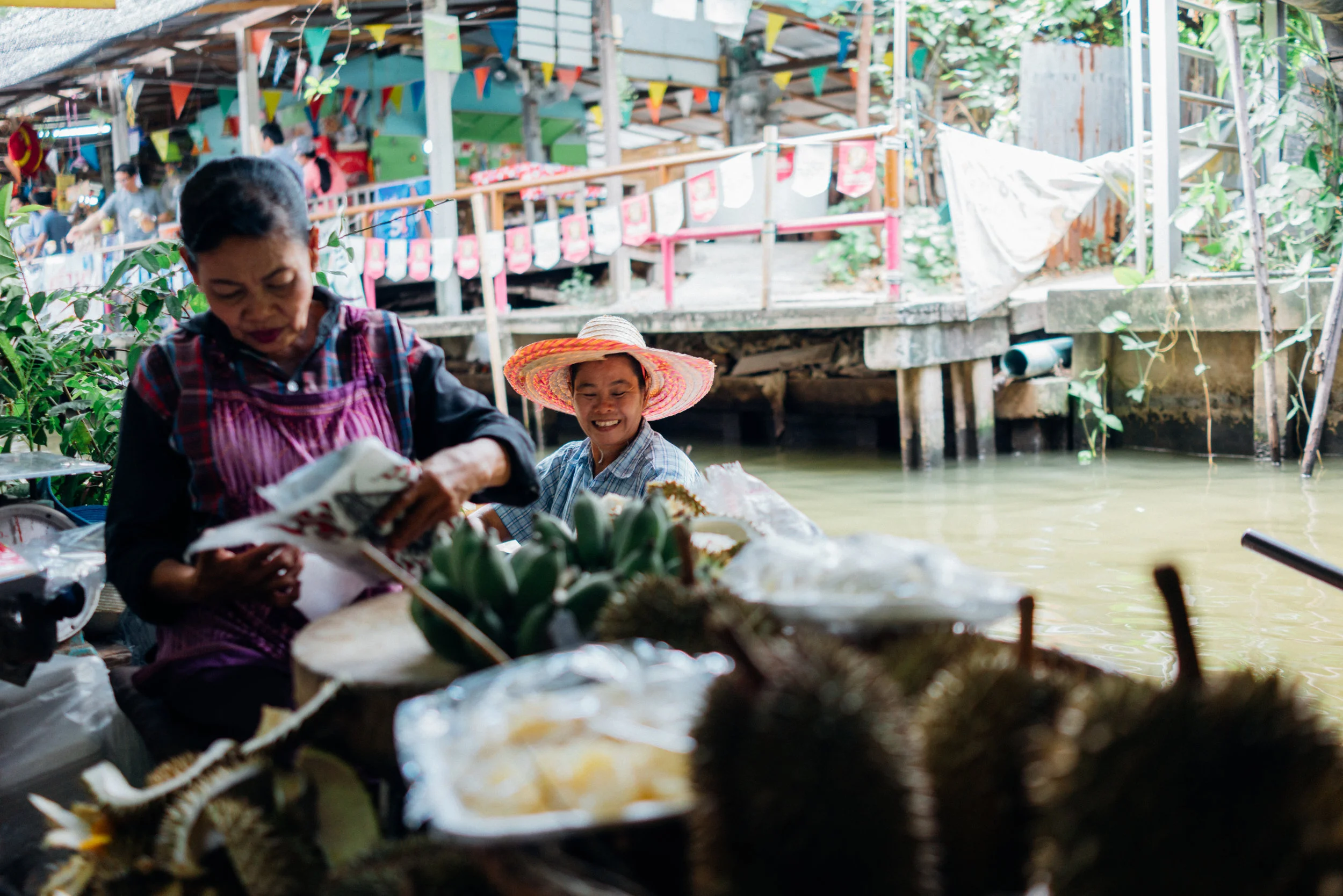 It's easy to forget, but canals used to be Bangkok's roads; most of these have been replaced by highways. Here are vendors at Khlong Lat Mayom Floating Market. 