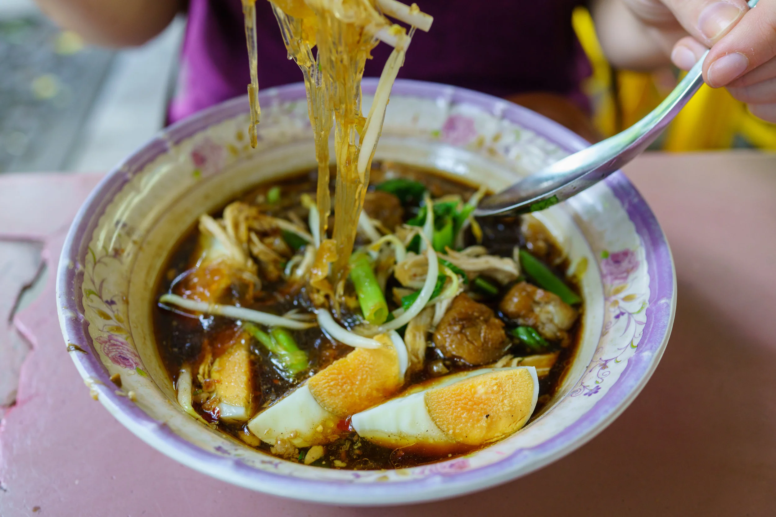 Kuay teow gai , chicken soup, for lunch at a street vendor in Bangkok