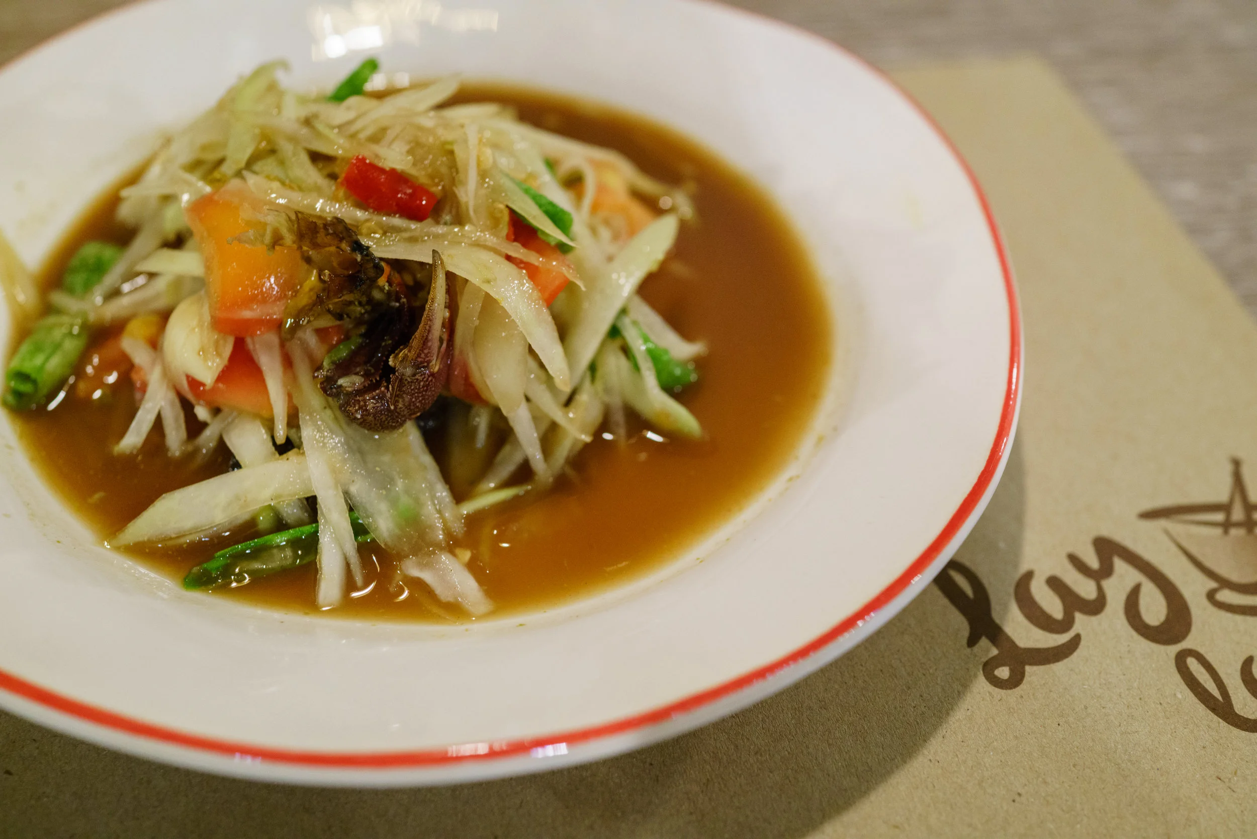 A spicy plate of som tam pla ra at Lay Lao, in Ari, for dinner