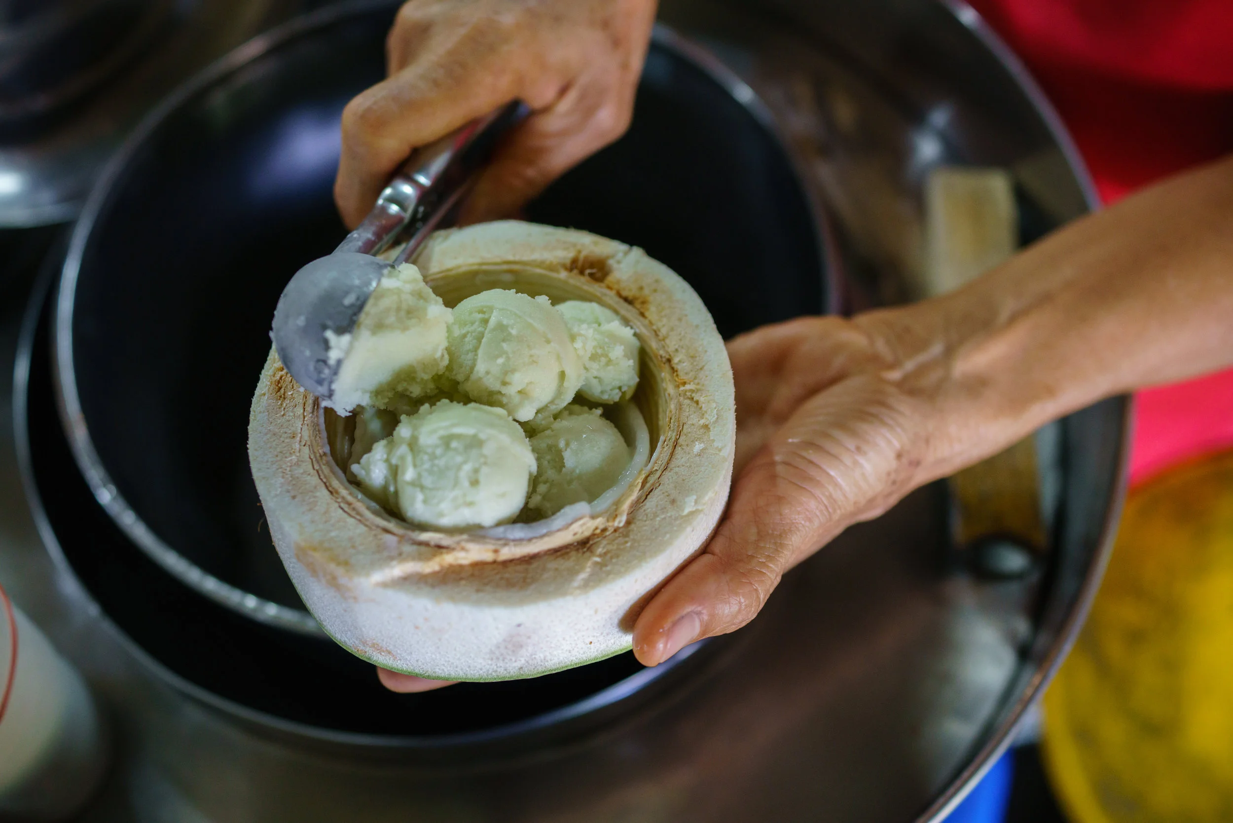 Refreshing coconut ice cream on a hot day, at Khlong Lat Mayom Floating Market