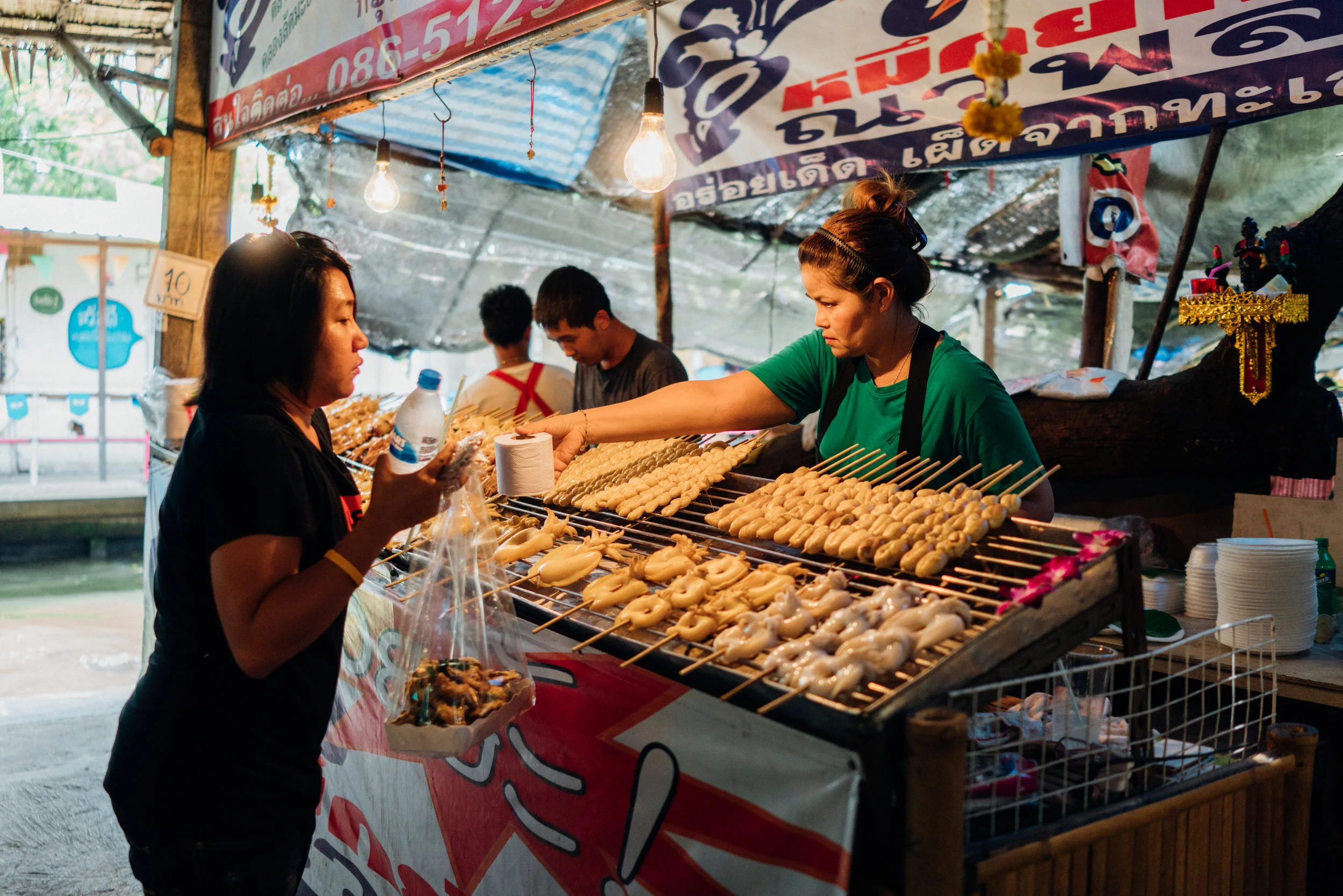 Meat and fish on skewers is a common snack in Bangkok
