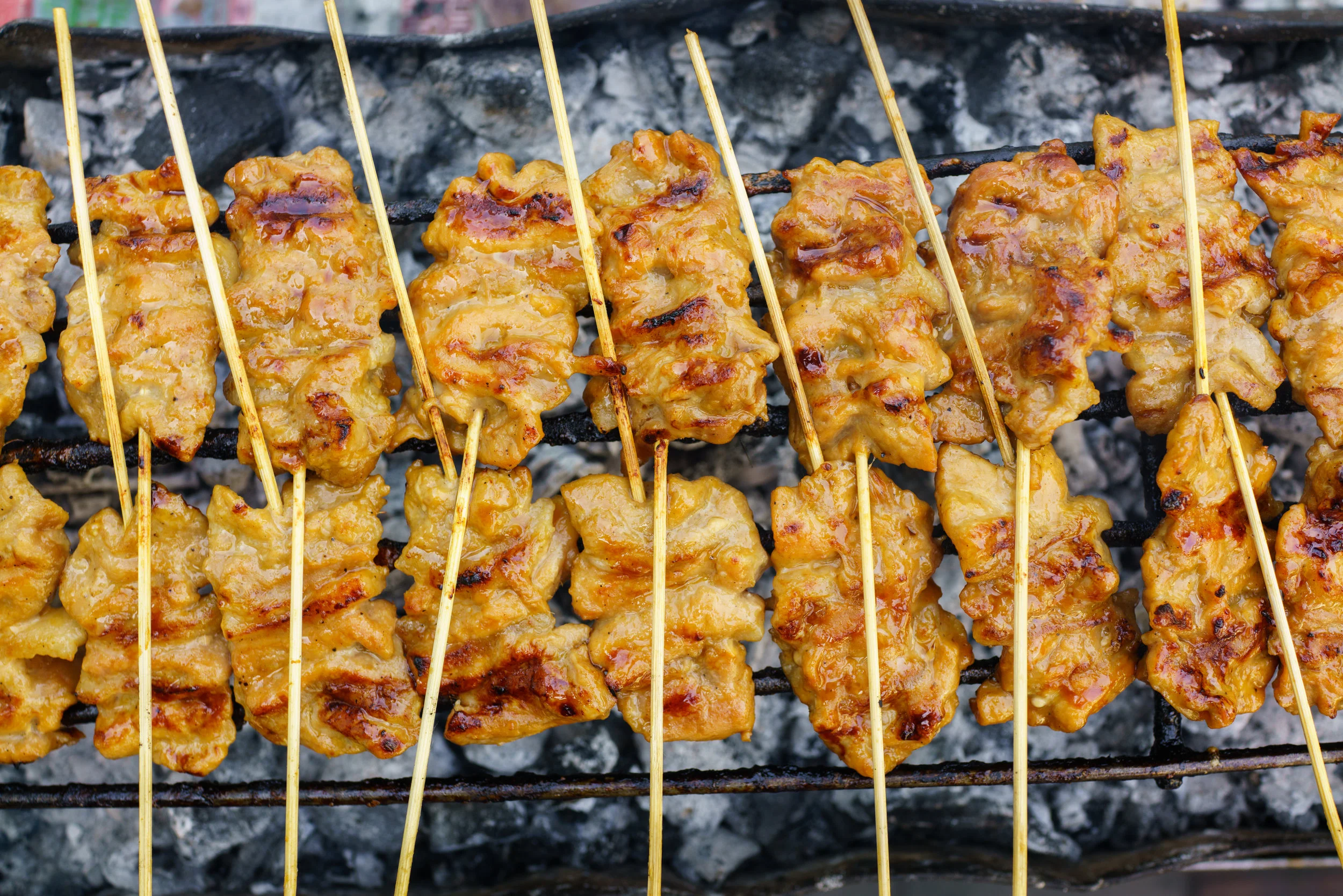 Pork skewers and sticky rice make a great snack