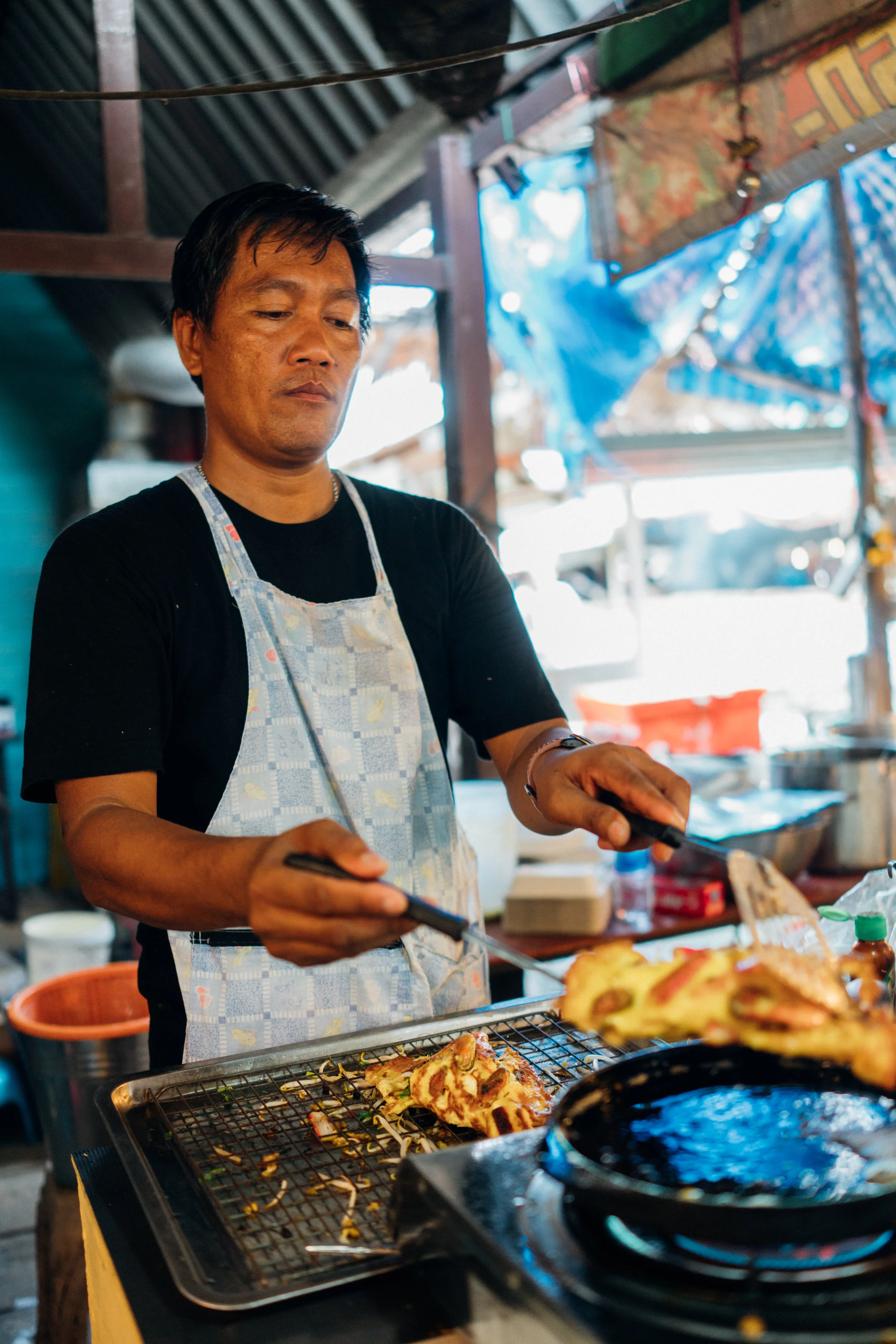 A vendor at Khlong Lat Mayom Floating Market