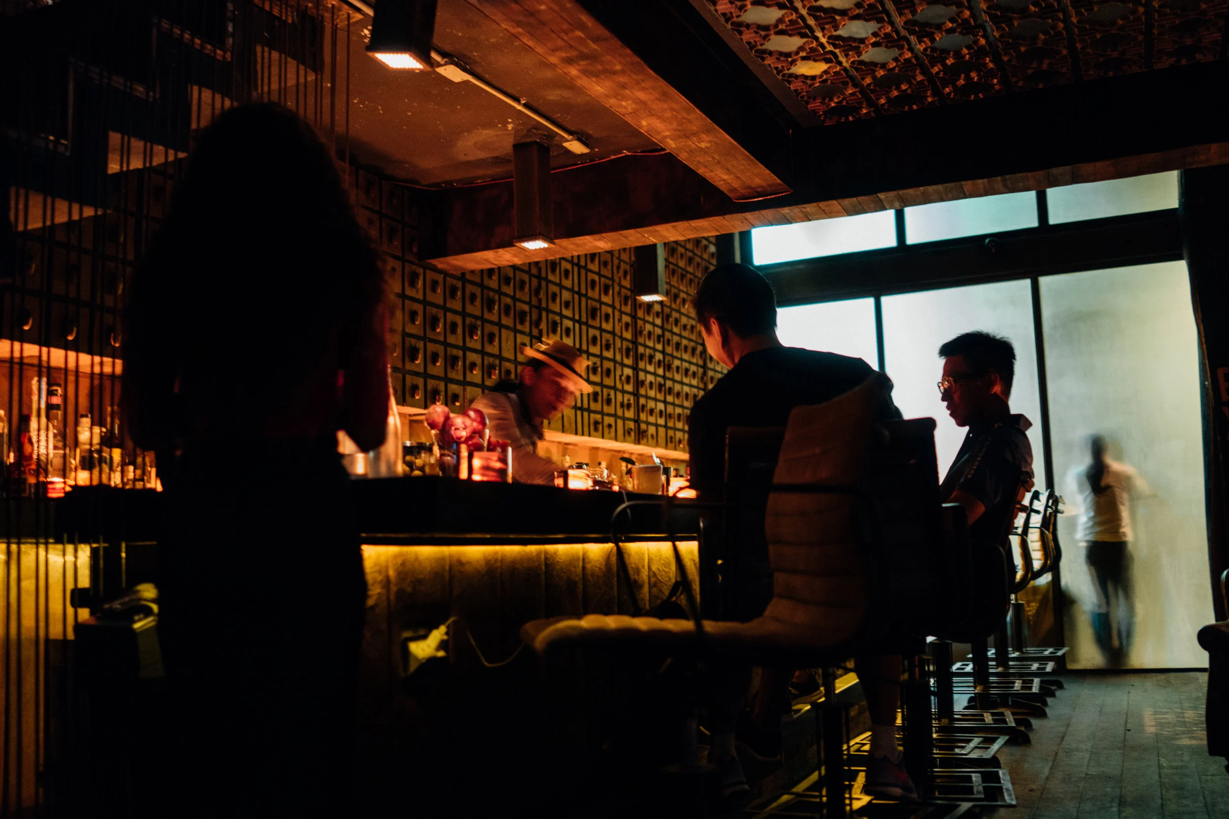 The bar at J. Boroski Mixology in Bangkok, as seen from our plush leather chairs