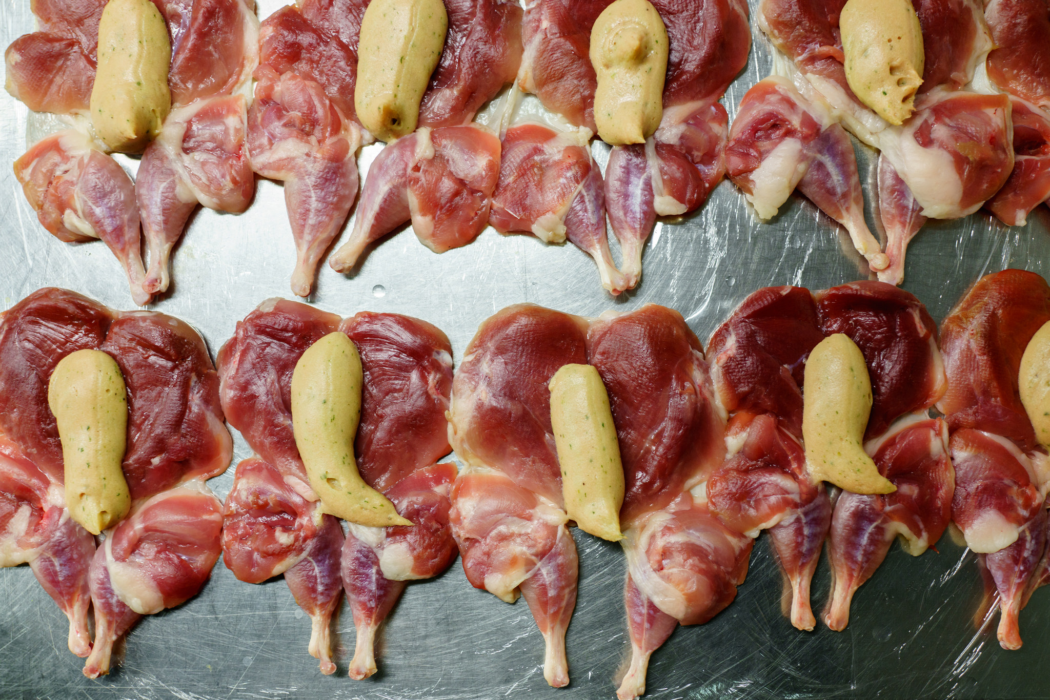 Quail being prepped for service