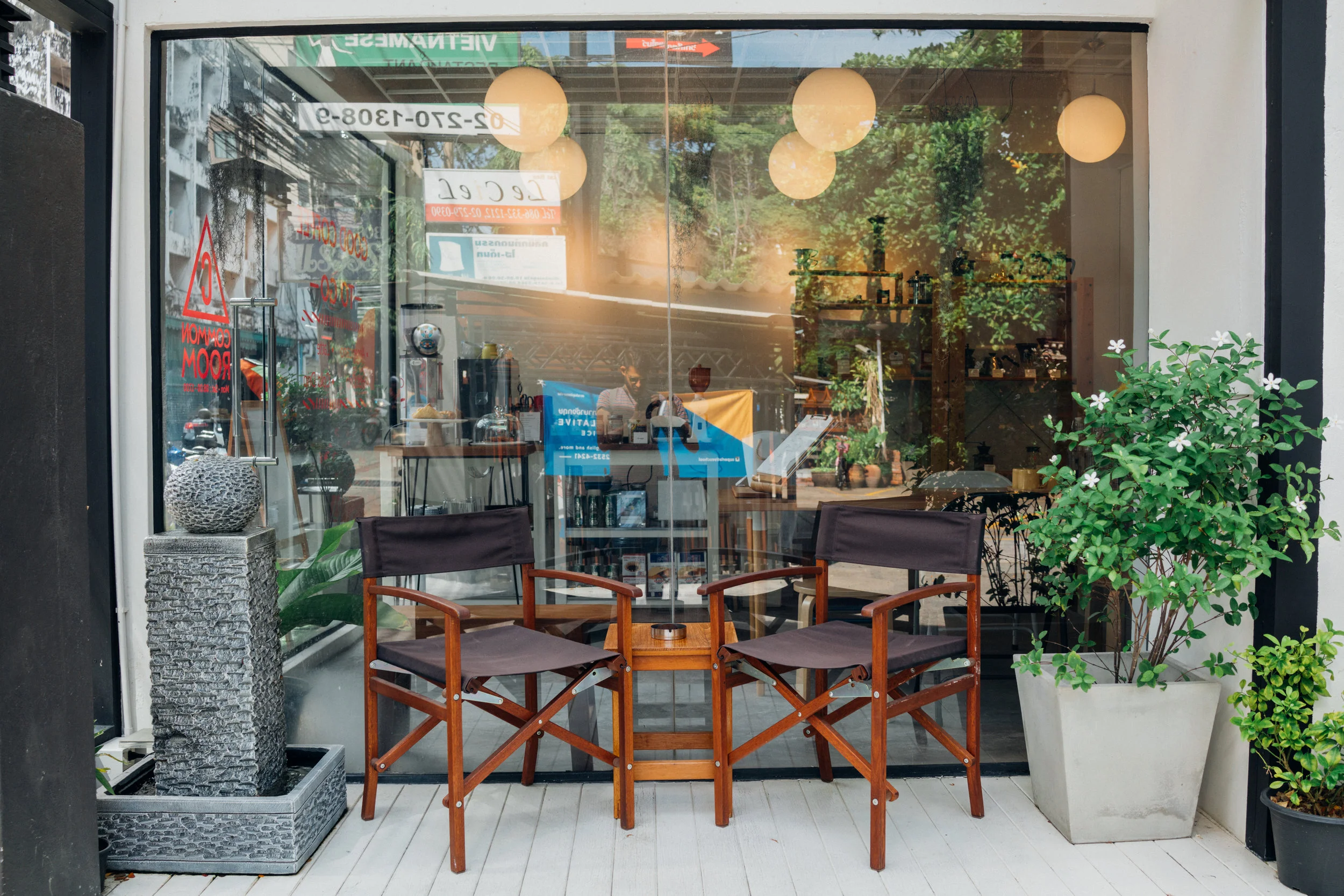 Side porch at Common Room, with Prem in the reflection