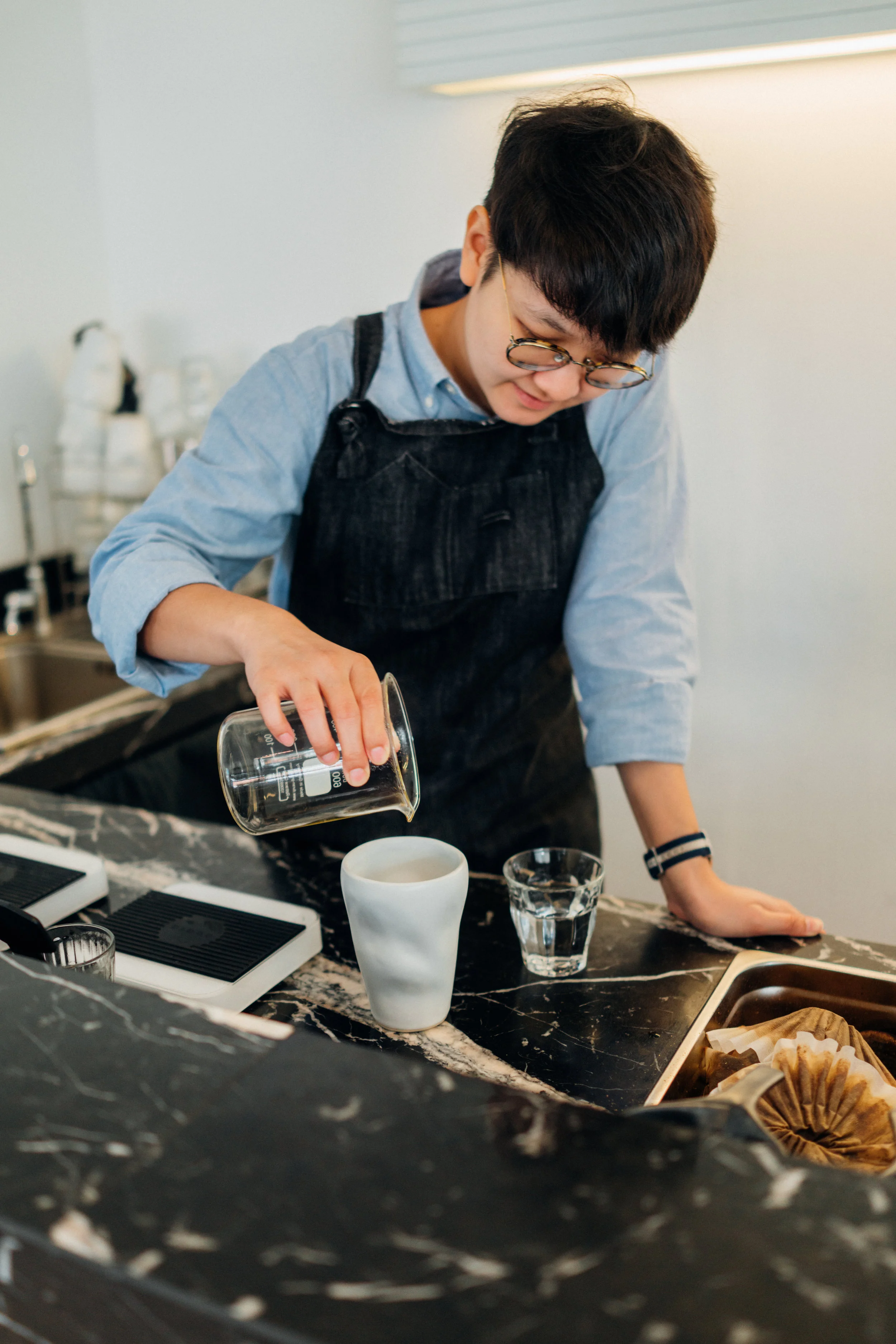 Pouring coffee at Hands and Heart