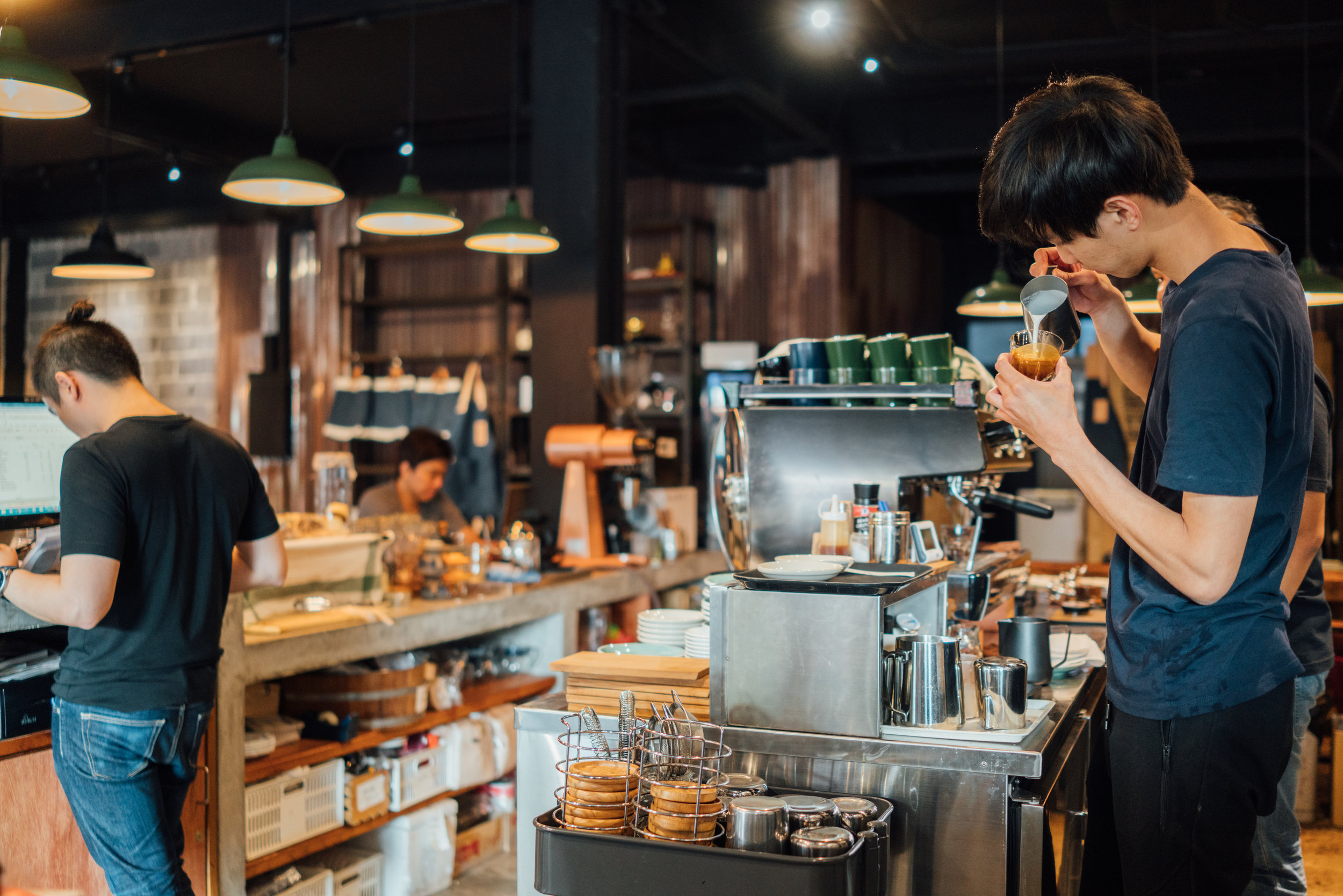 Making latte art at Factory Cafe in Bangkok