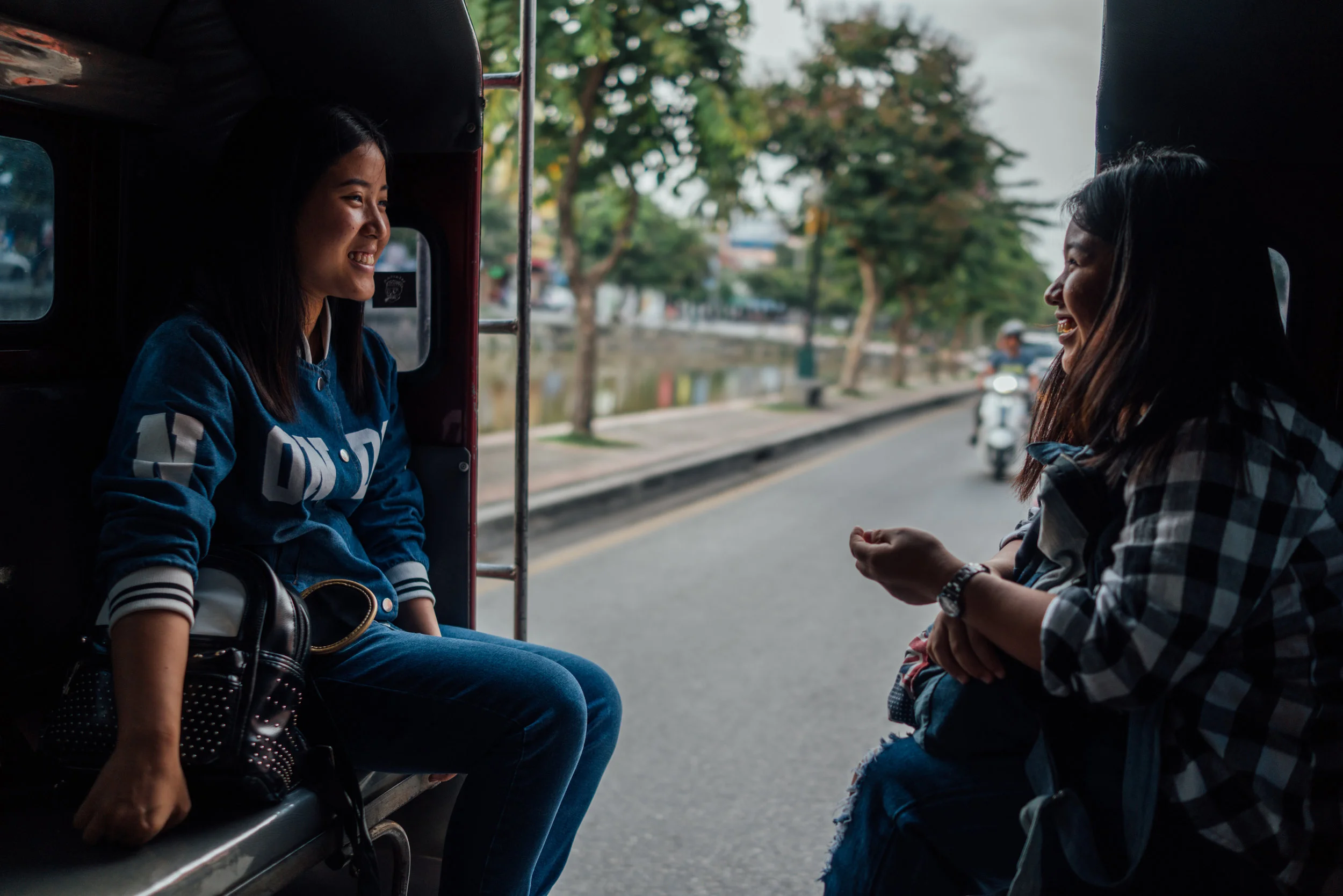 Beautiful smiles during a songthaew ride