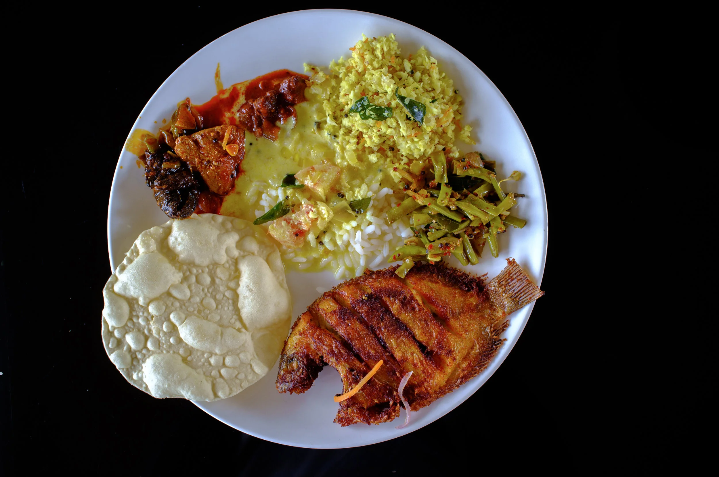 Karimeen Porichathu , as part of a meal