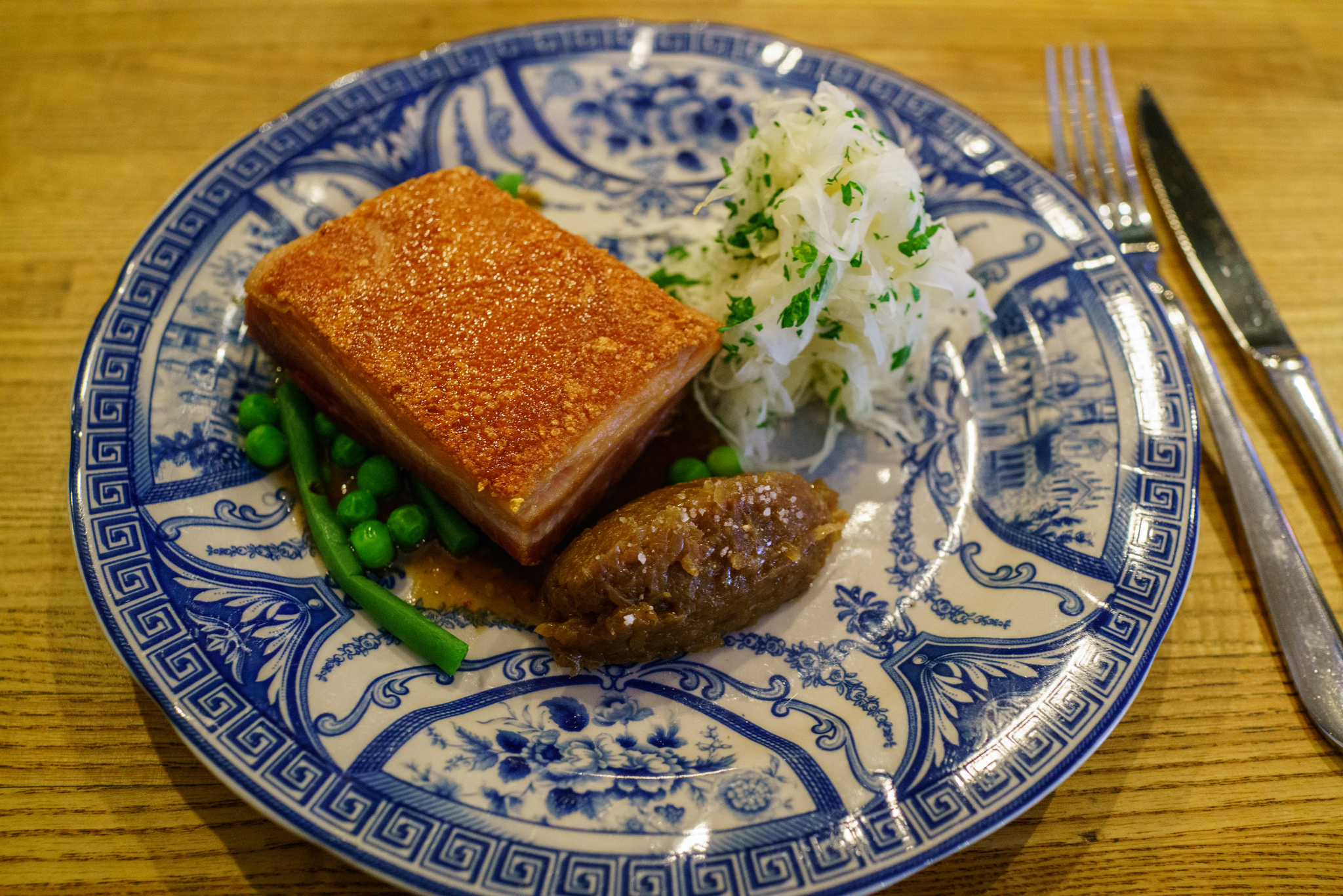 Pork confit with cabbage, beer braised onions & roasted garlic at Rolfs Kök, Stockholm