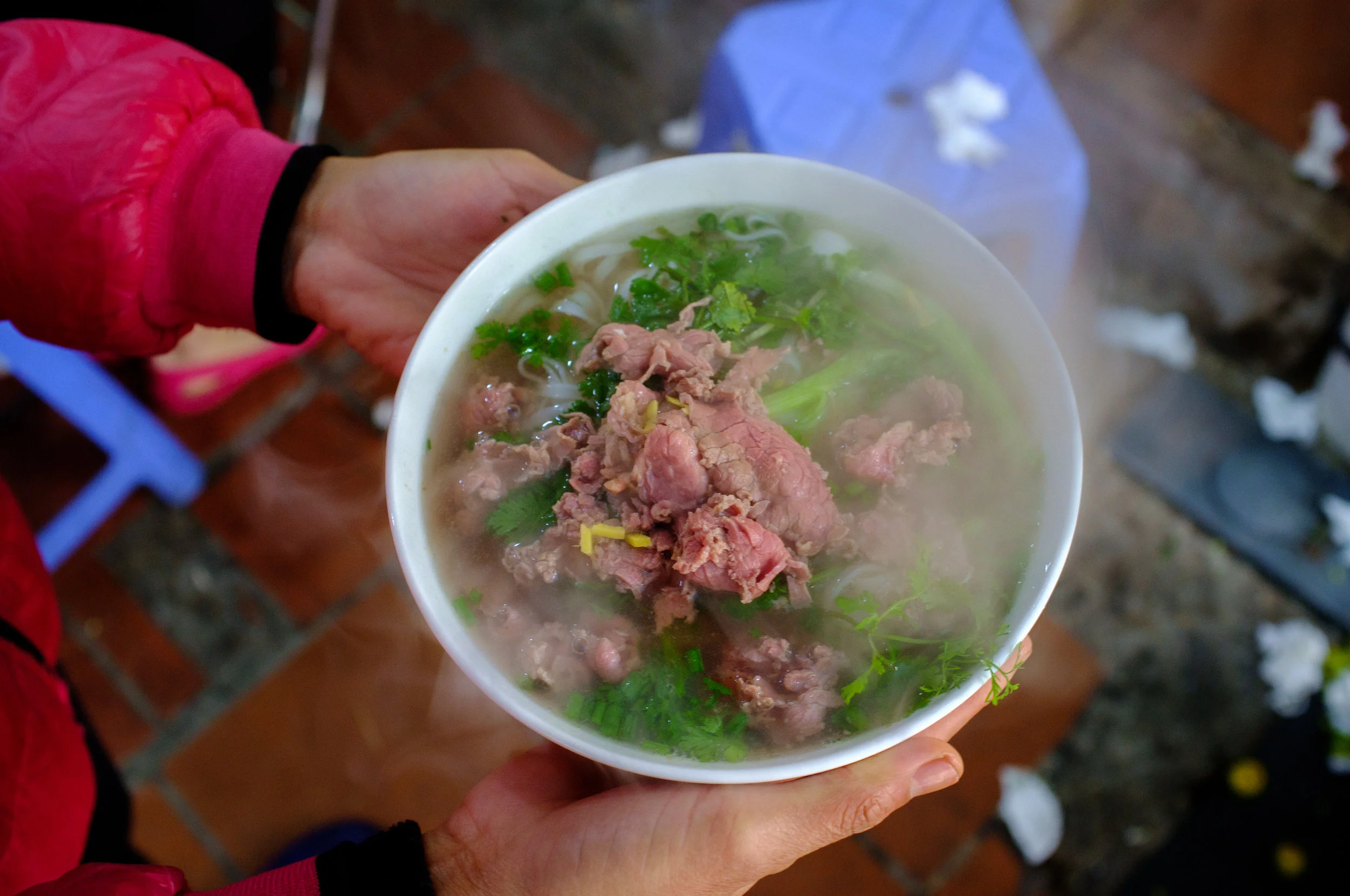 Steaming bowls of p hở kept us warm on cold Hanoi mornings 