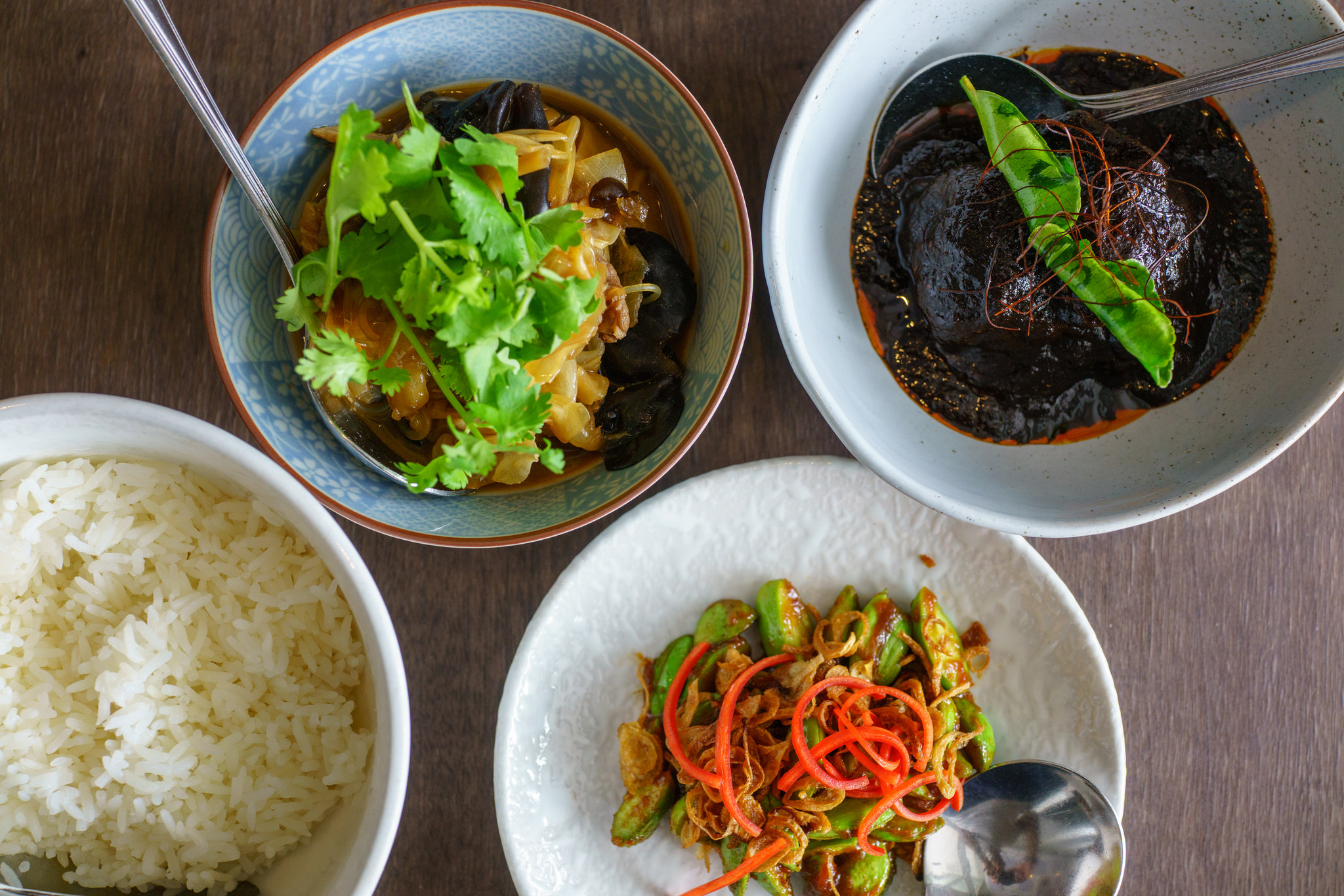 From top left, clockwise: Chap Chye, Buah Keluak, Sambal Kacang Petai, plain rice