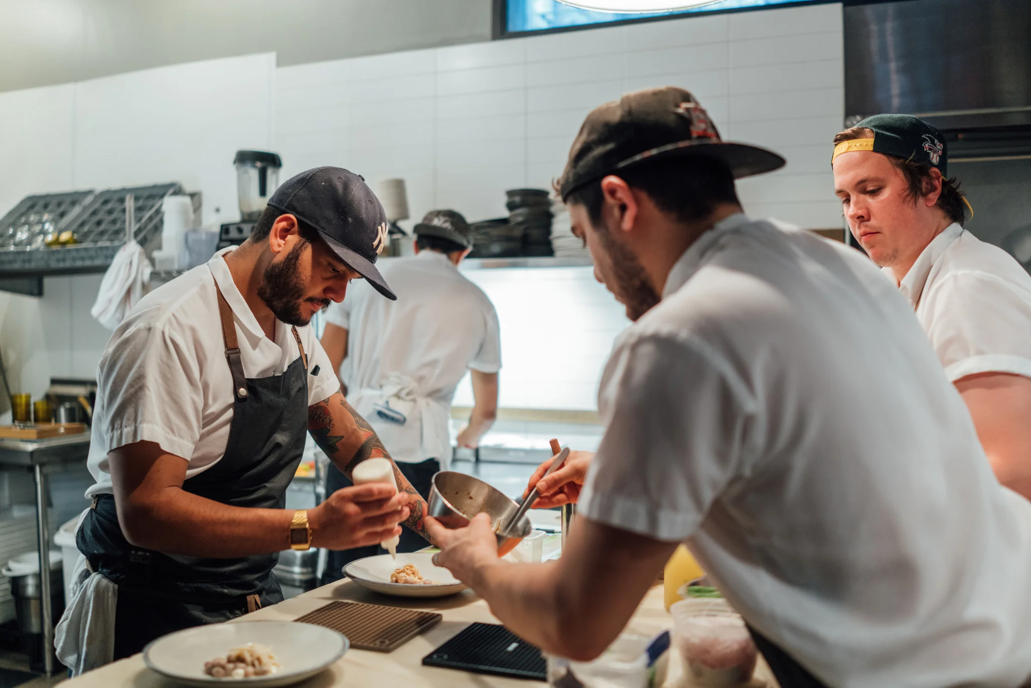 Sous chef Diego and his team at the kitchen in Contra, New York City