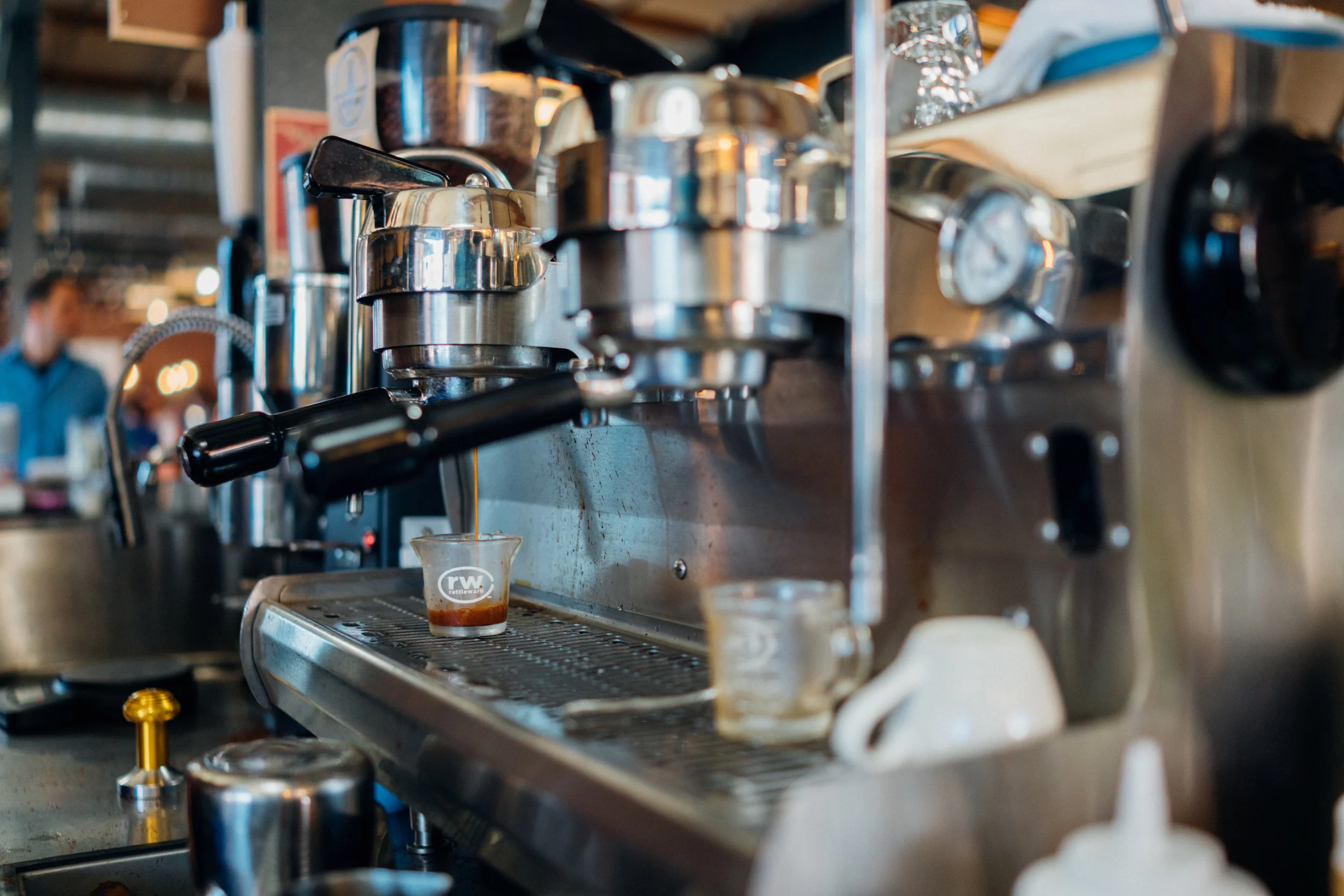 Pulling a shot of espresso at Crema Bodega within Denver Central Market