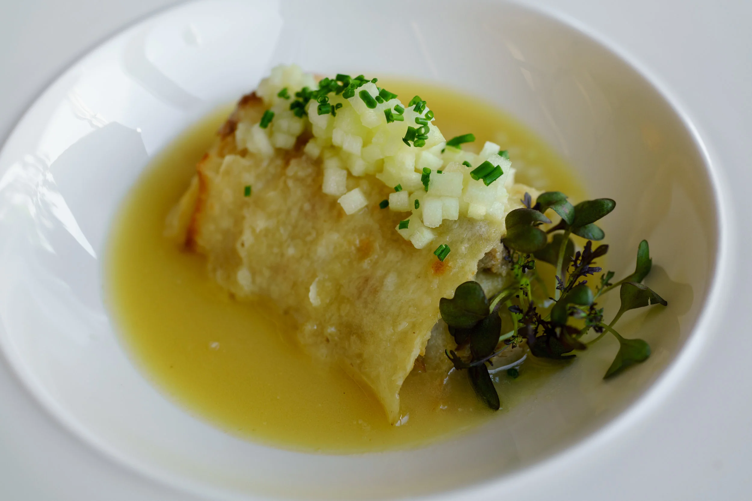 Turkey confit, Croatian style flatbread, green apple, chive, white wine, and horseradish sauce