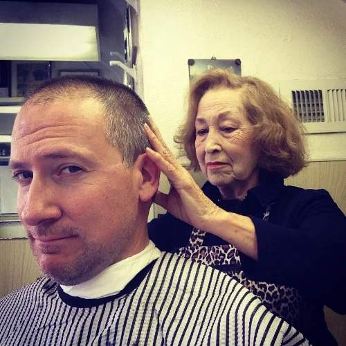 Steve Harbour getting a hair cut