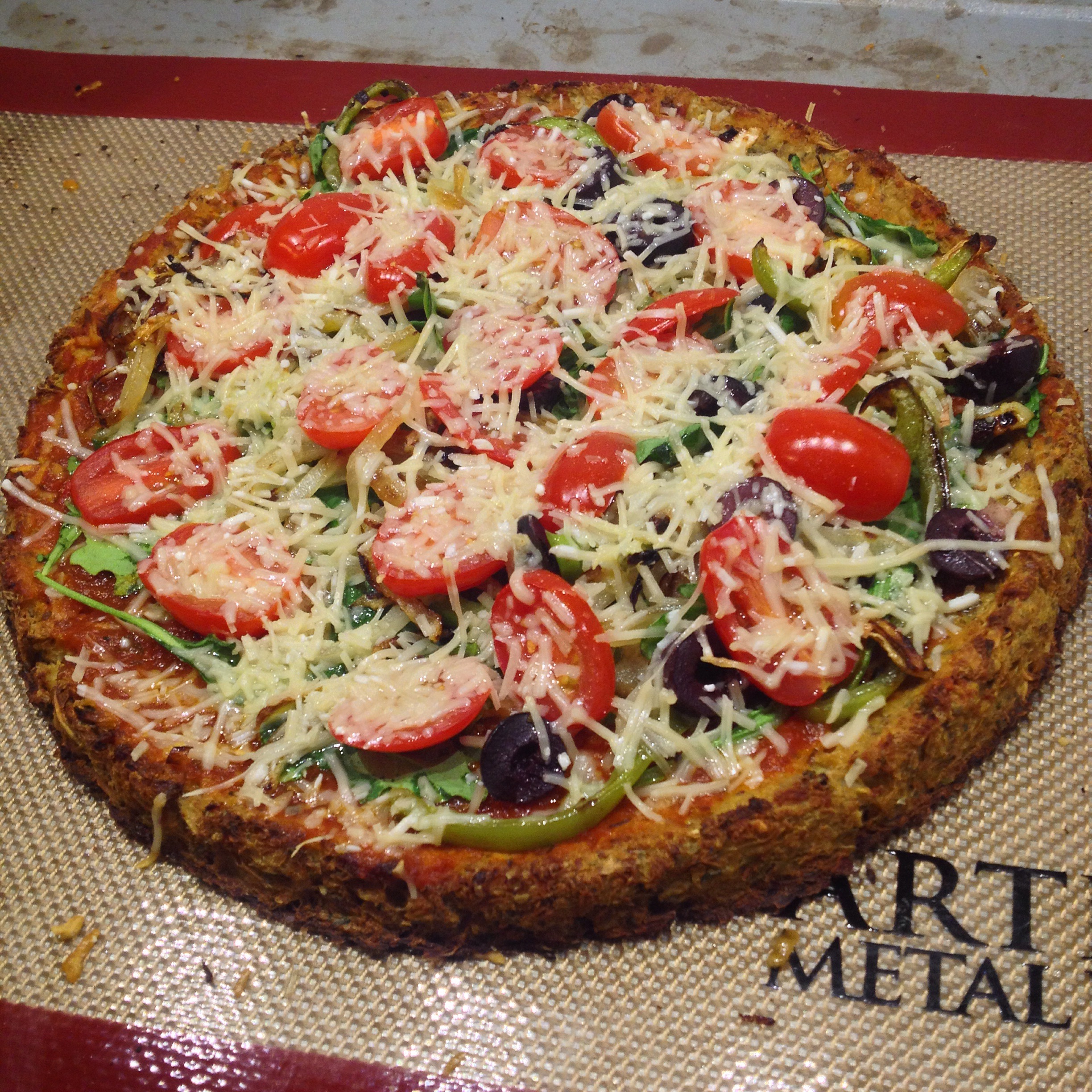 We topped ours with tomato sauce, arugula, sautéed onions and green bell peppers, olives, tomatoes, and parmesan cheese. SO GOOD!!!