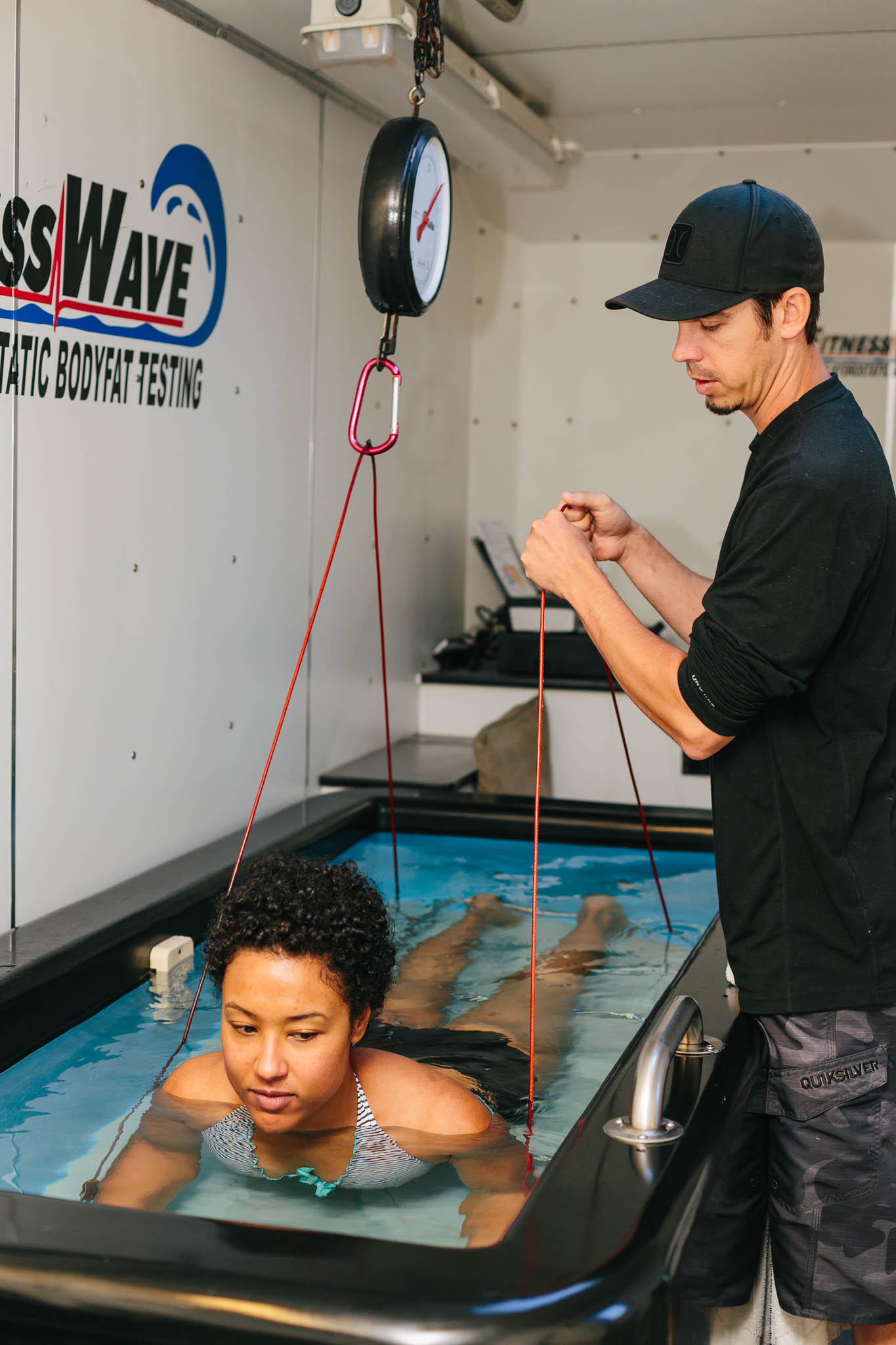 Getting prepared to submerge myself under water and have my water weight measured. 