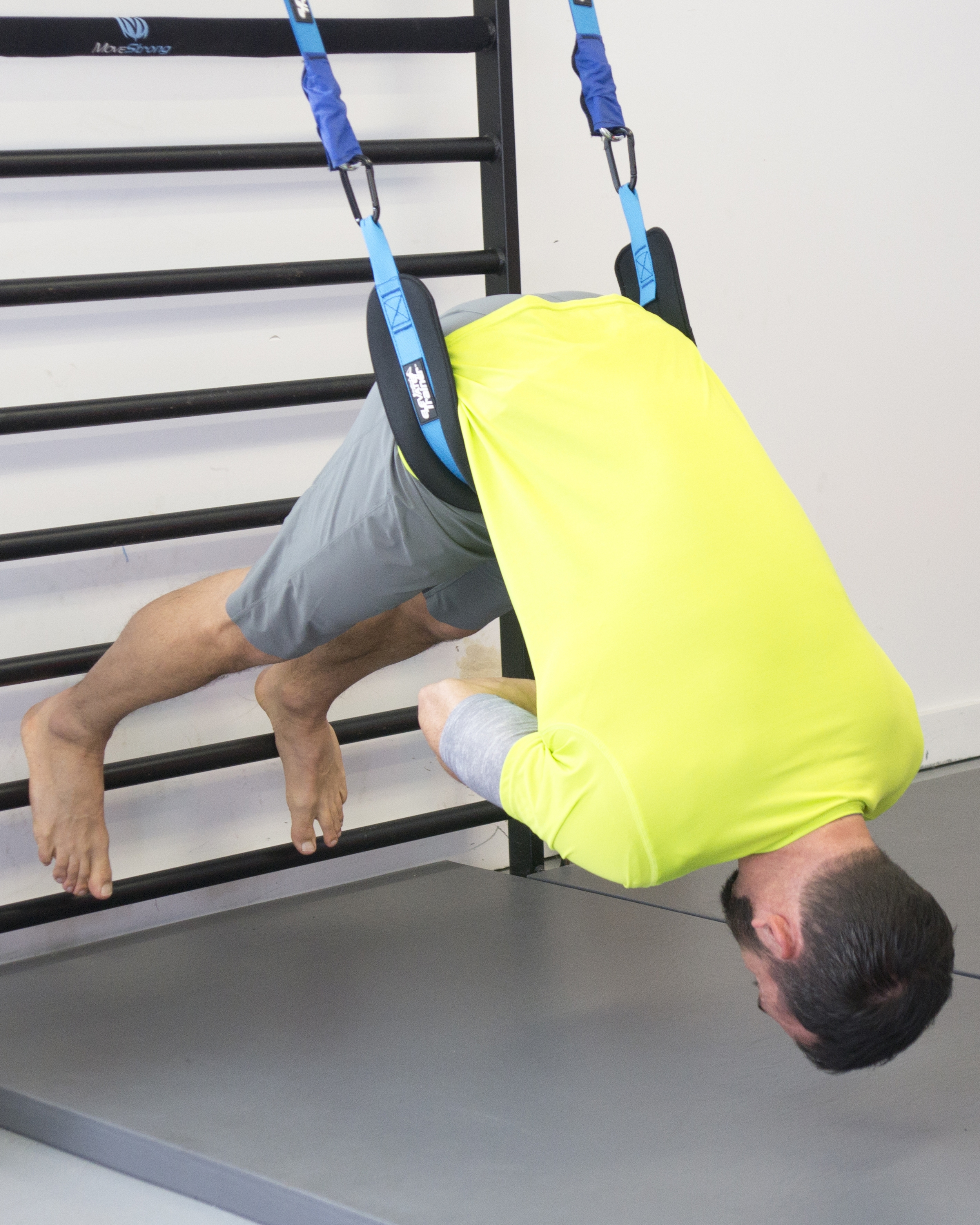 Elevate Belt hip extension on Stall Bars