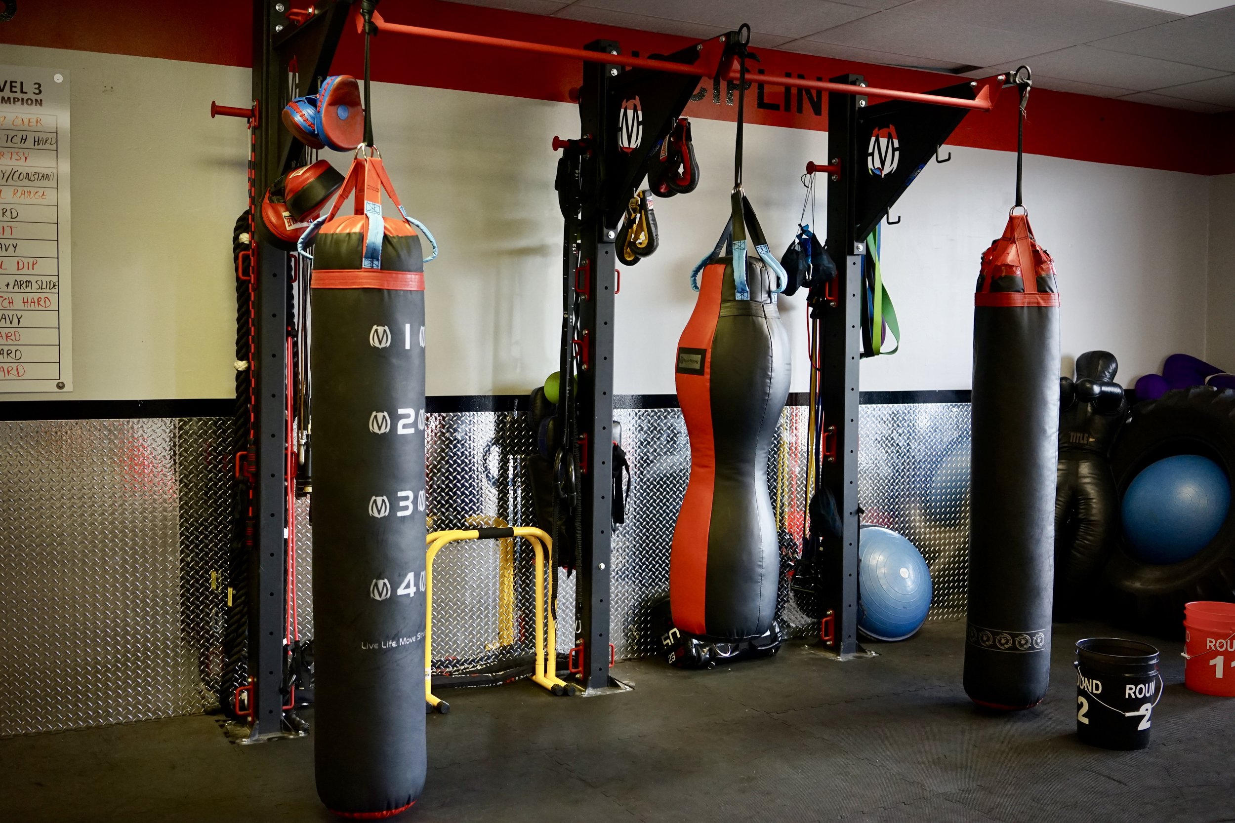 Modular heavy bag stand with pull-up bars