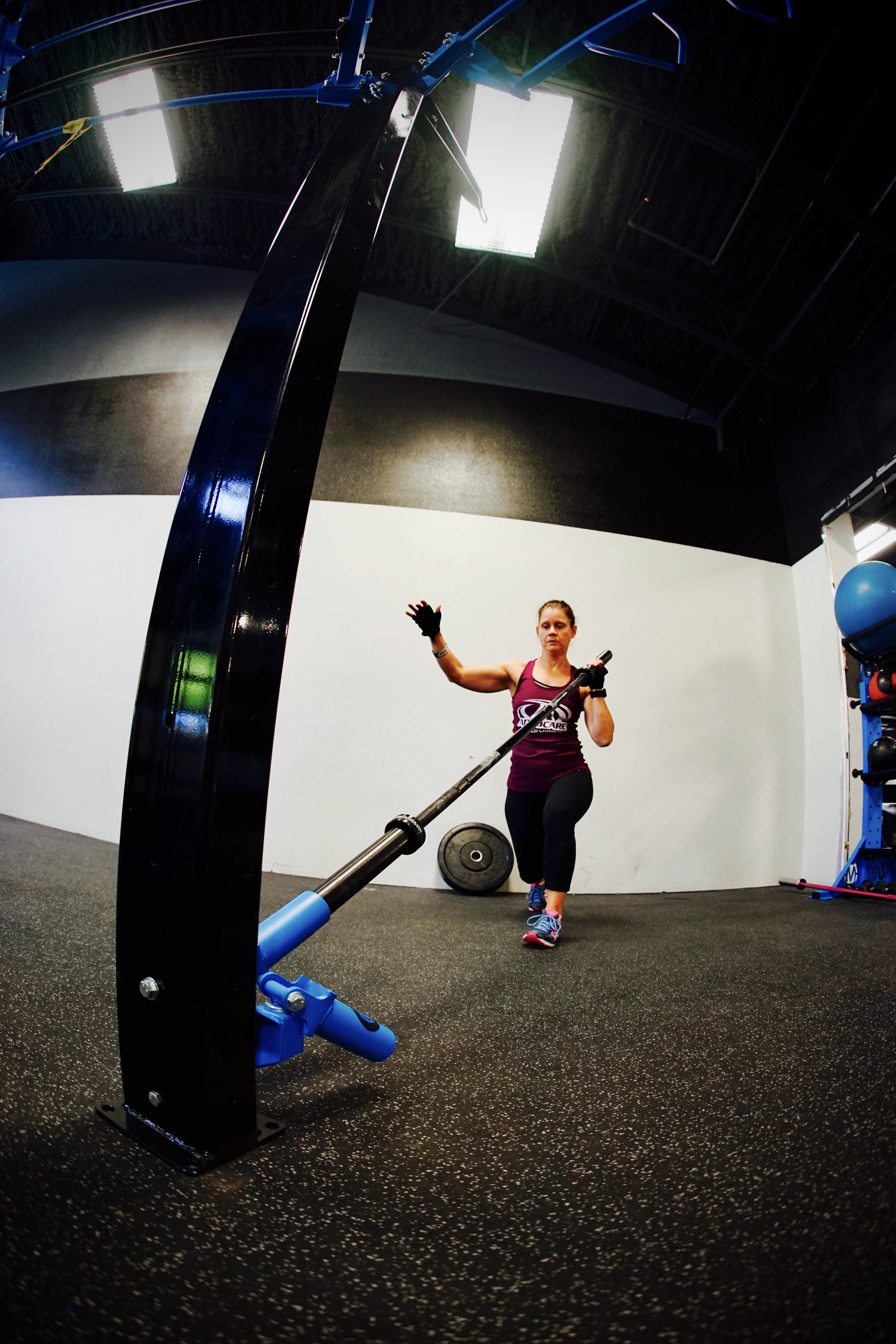 Ground Rotational Trainer lunge to press