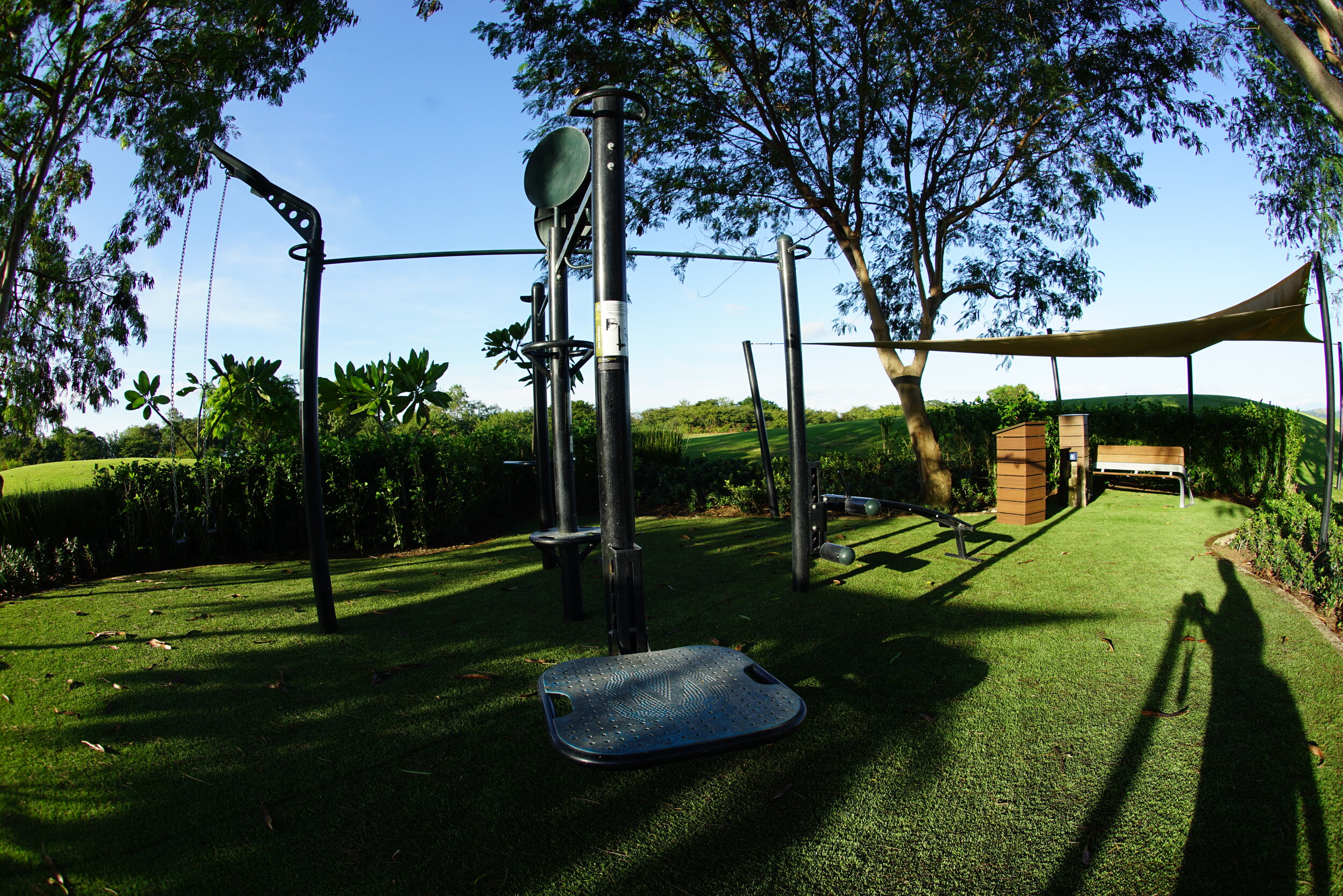 Outdoor fitness equipment with shaded canopy