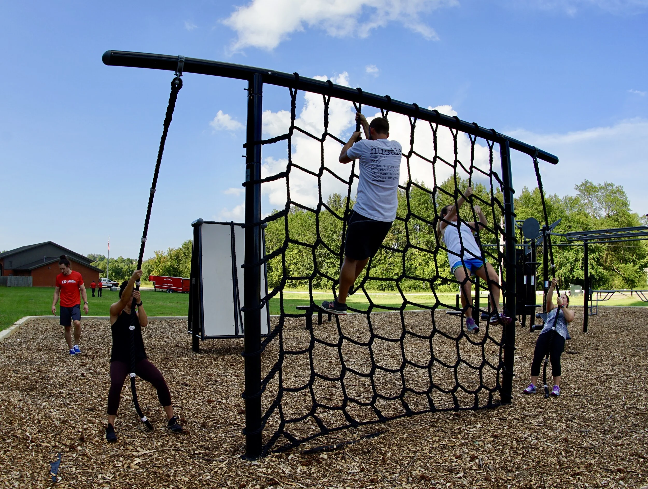 Team Workouts On the Cargo Net And Rope Climb Station