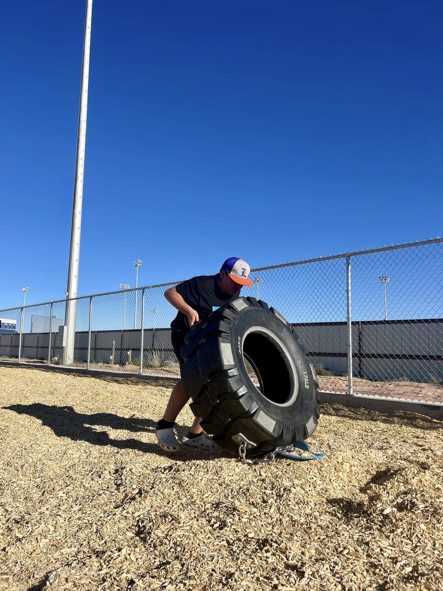  man flipping tire 